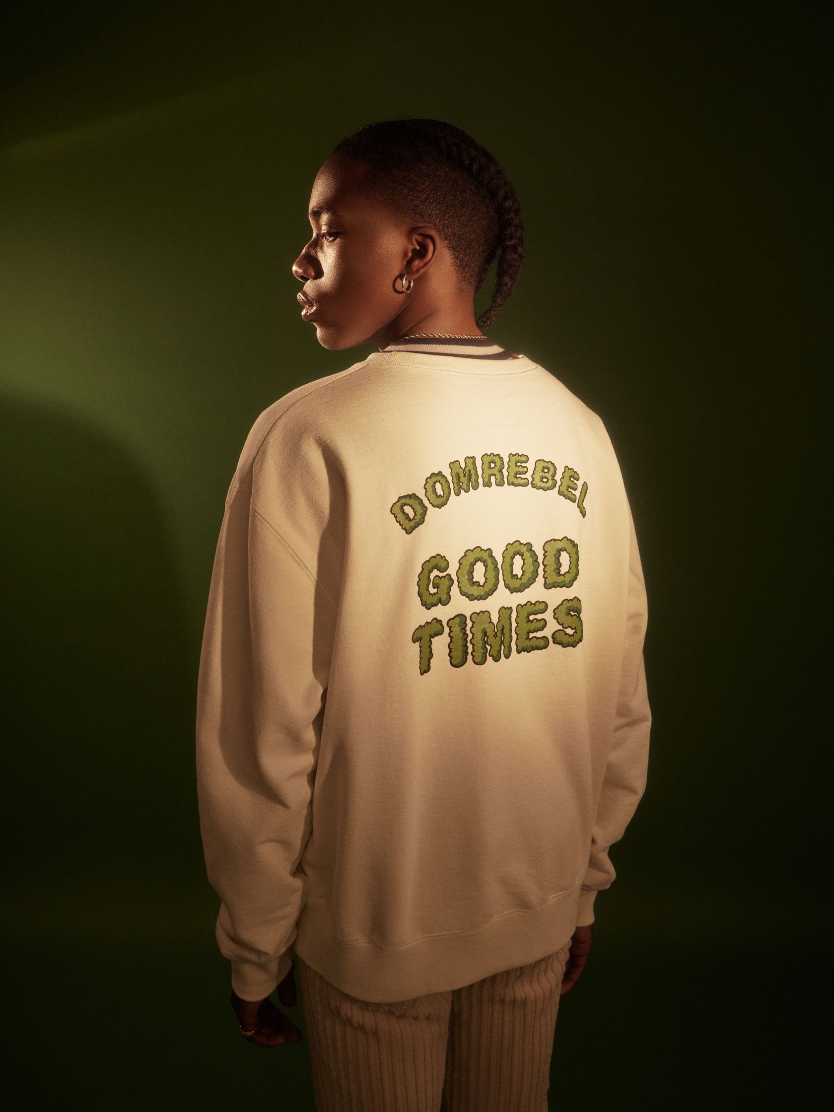 the back of a woman wearing a sweatshirt that says good times