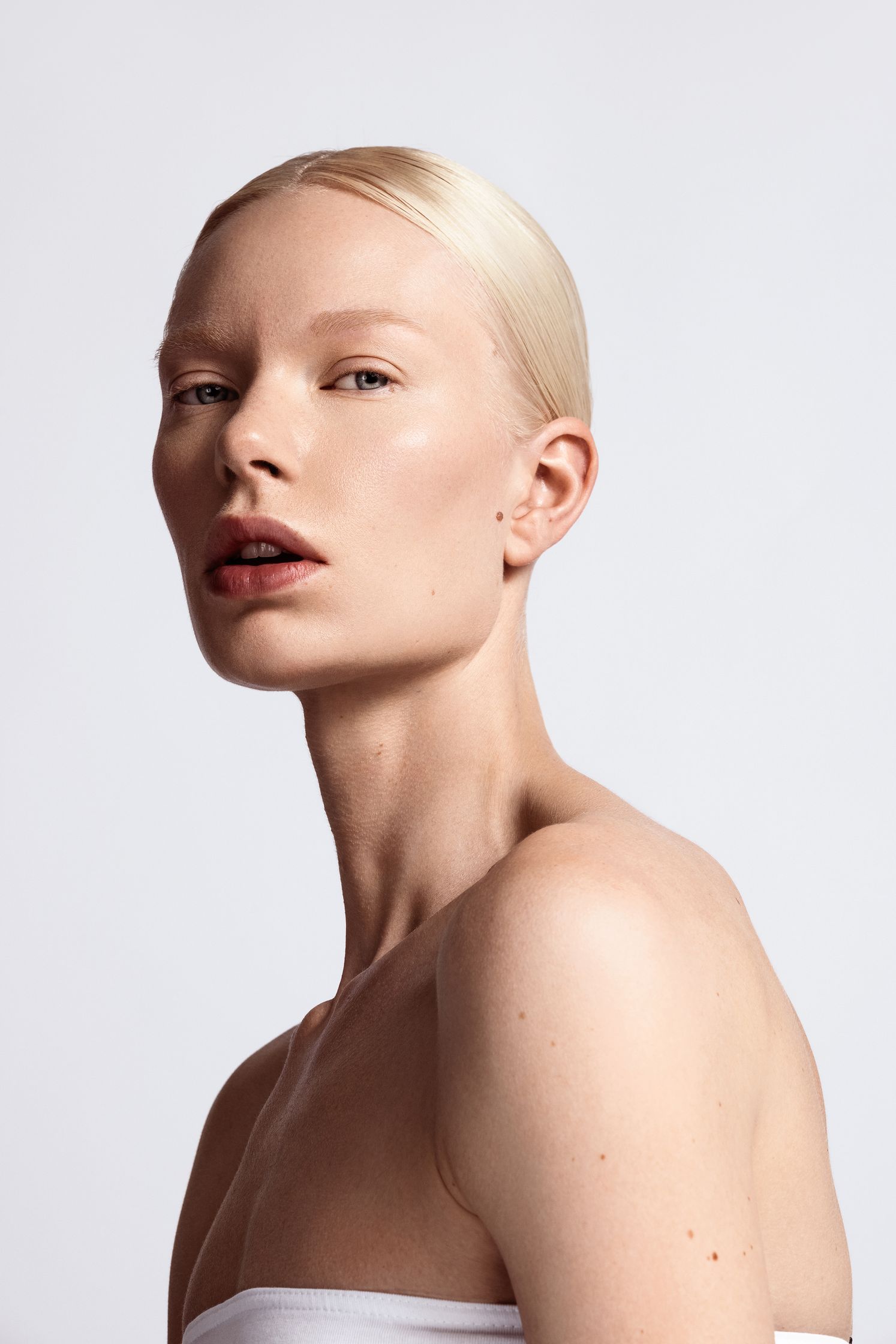 a woman with blond hair is posing for a photo