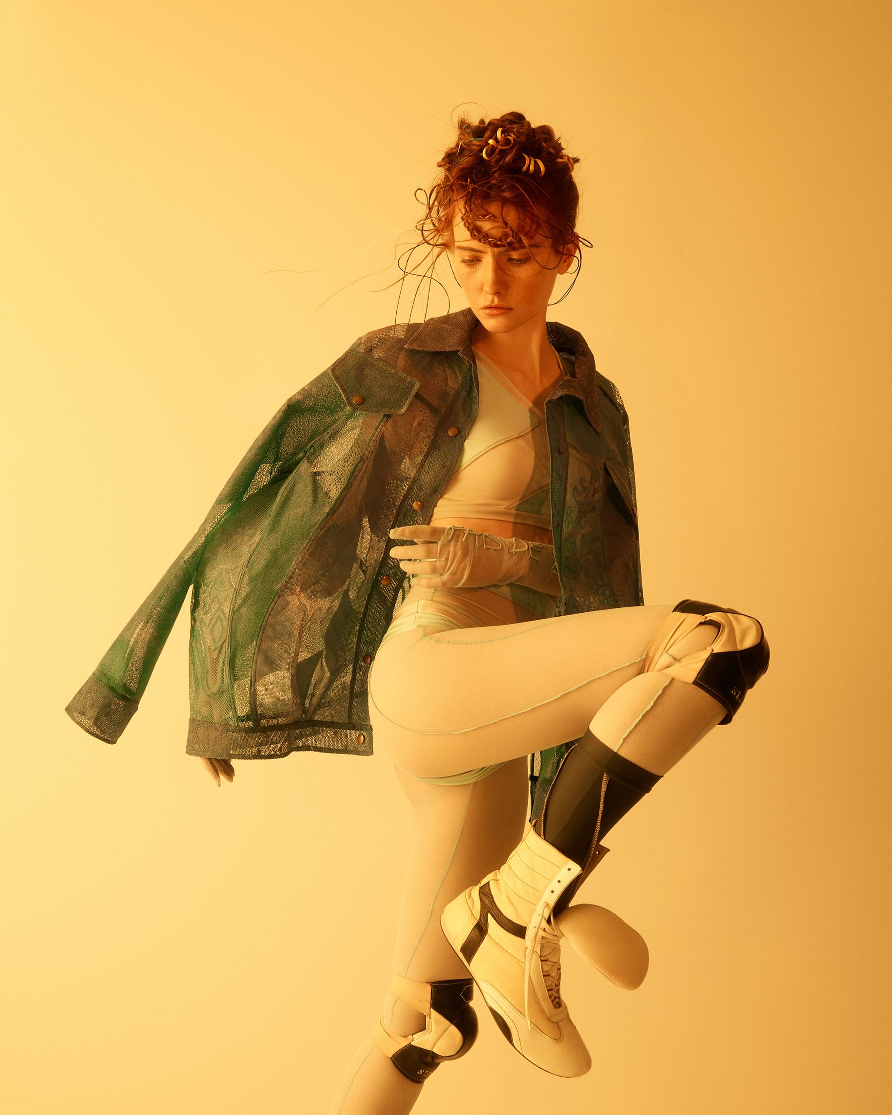 a woman in a white jacket and white leggings