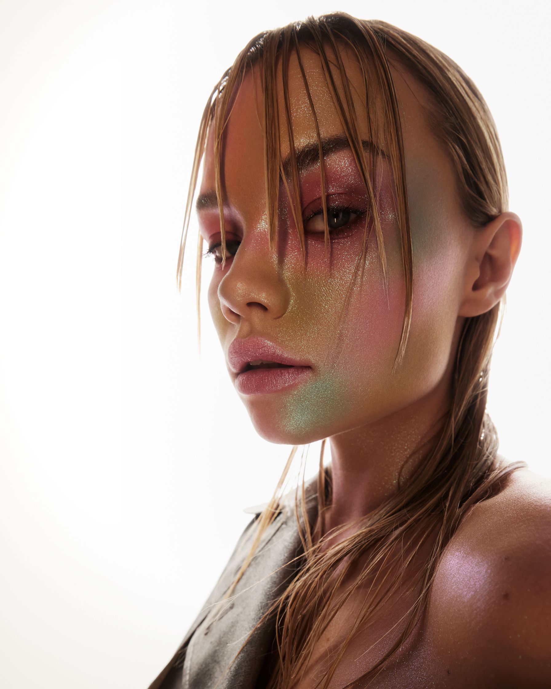 a woman with colorful makeup on her face