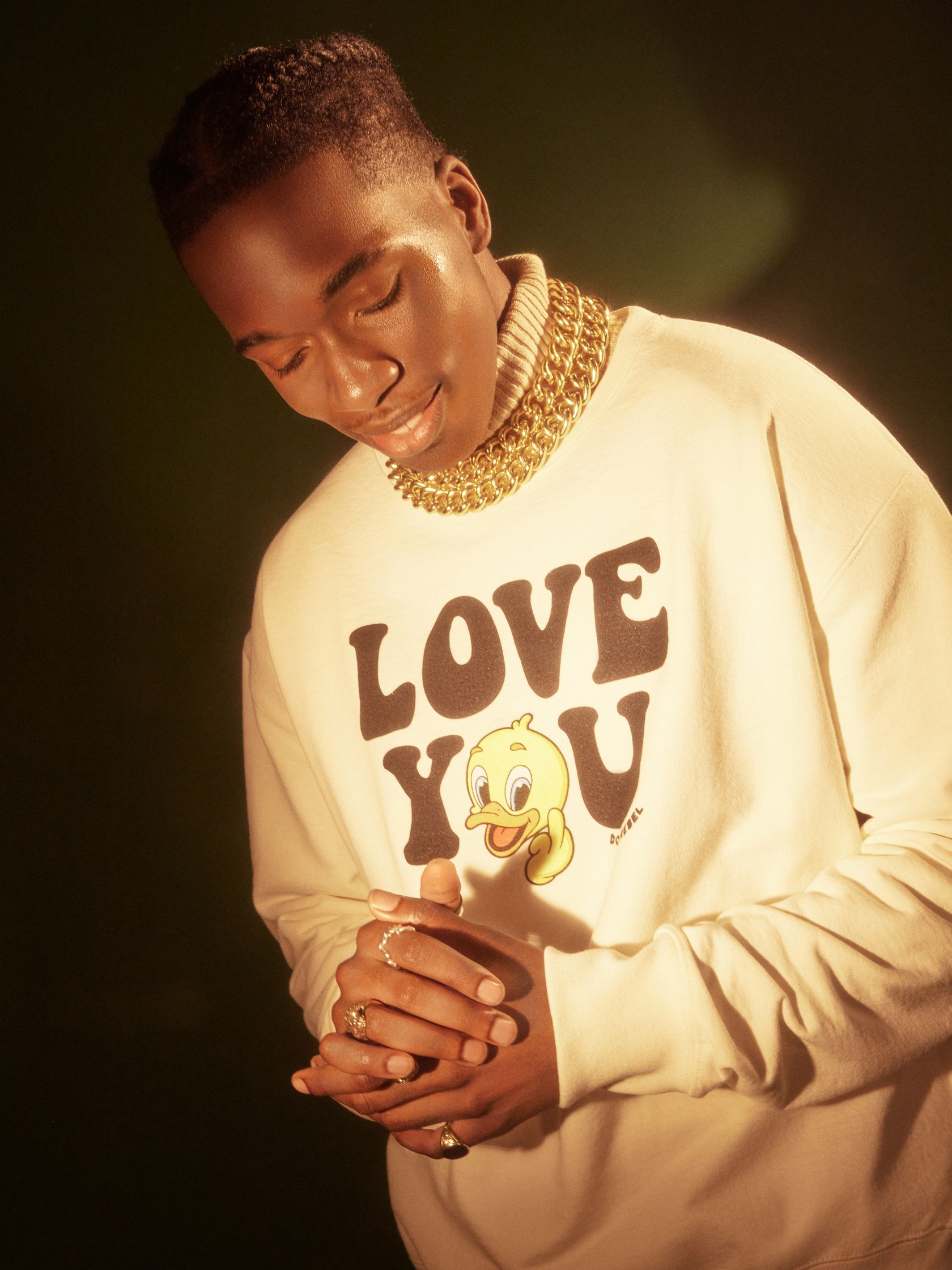 a man wearing a sweatshirt with the word love you on it