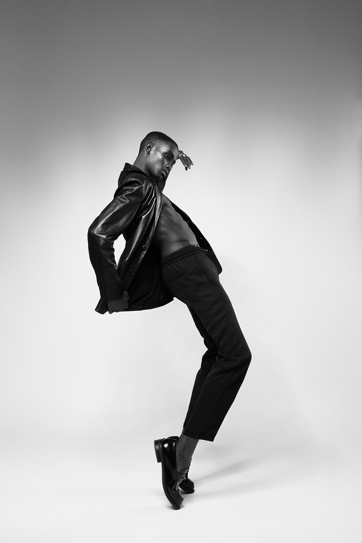 a black and white photo of a man dancing