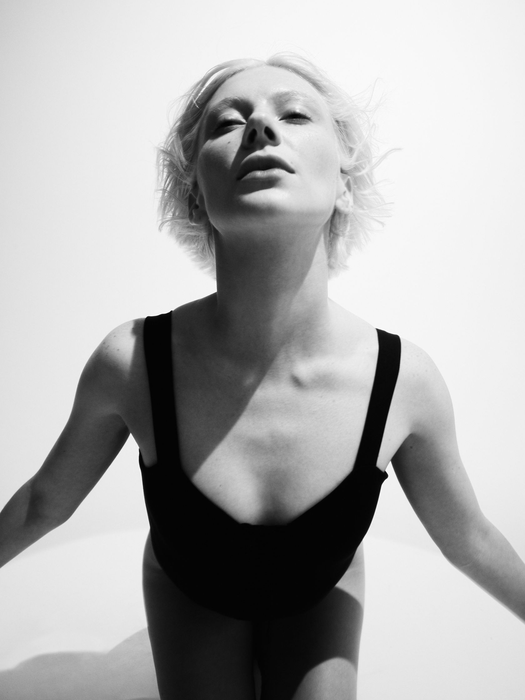 a black and white photo of a woman posing