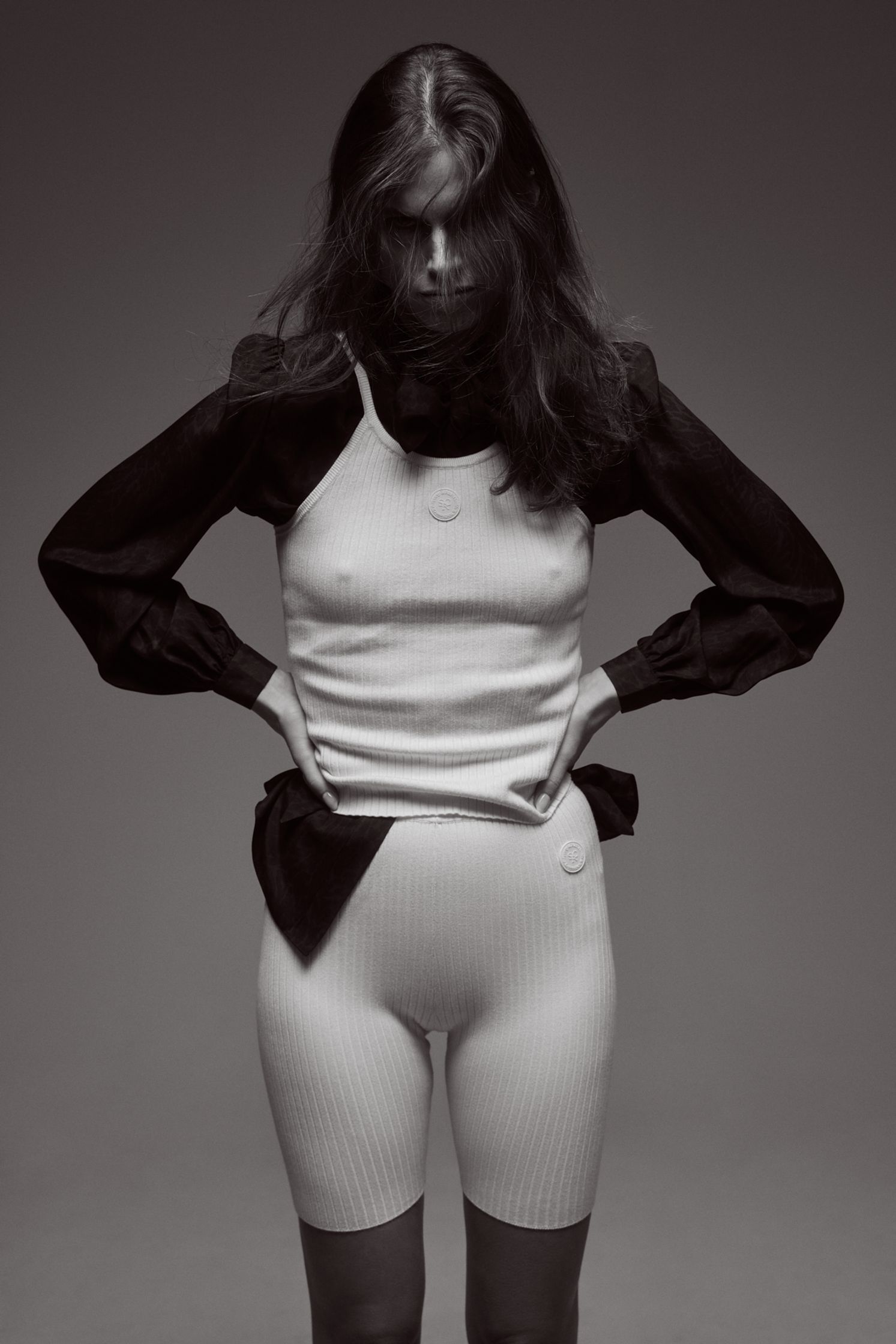 a black and white photo of a woman posing for a magazine