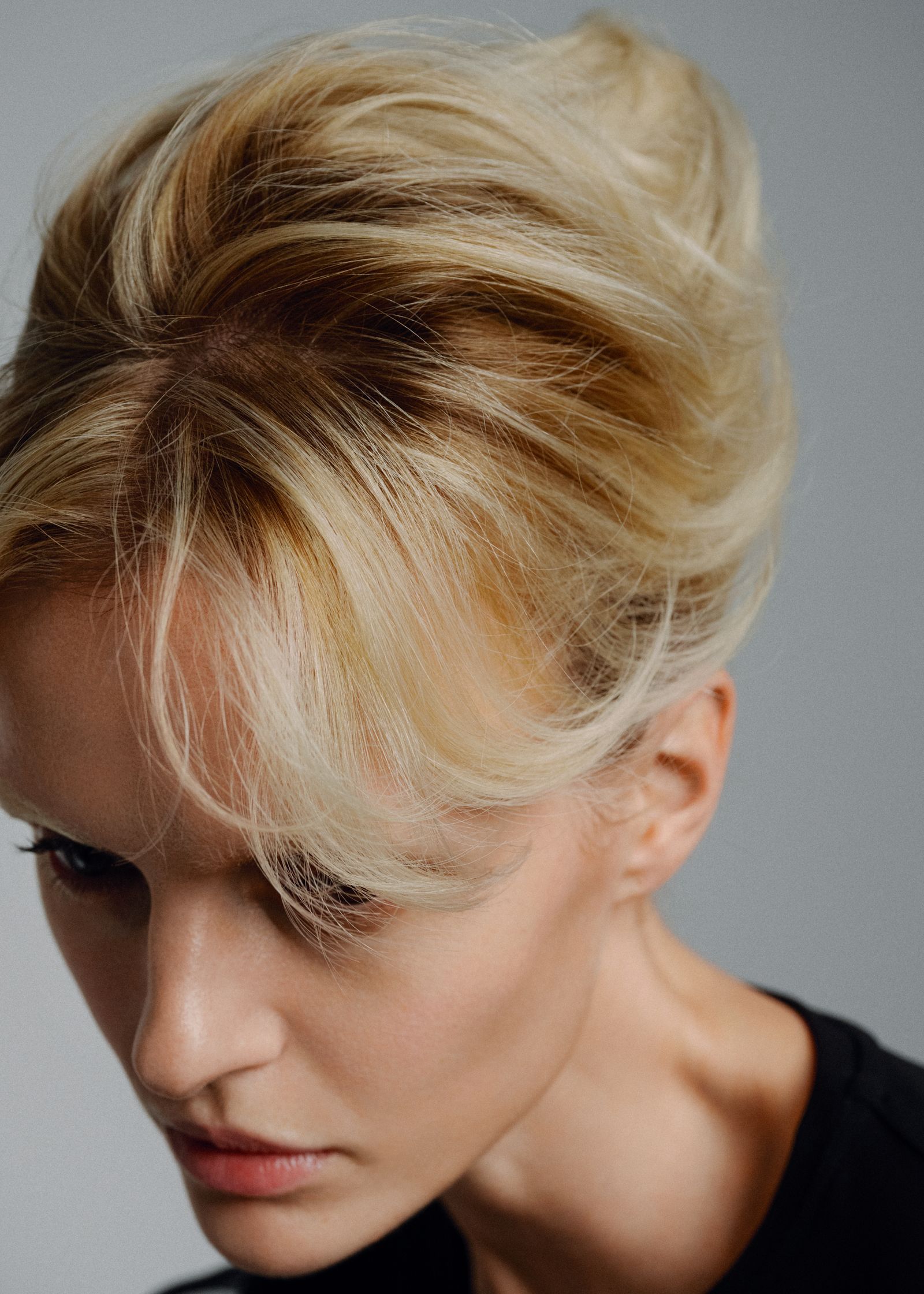 a woman with blonde hair in an updo
