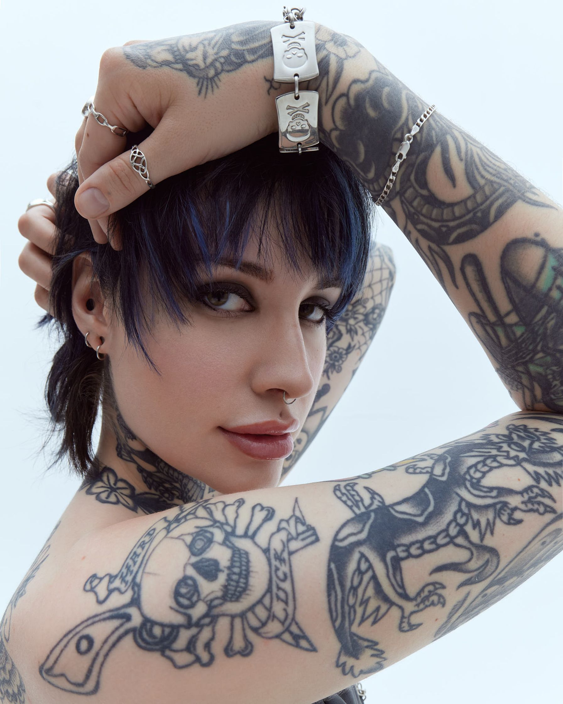 a woman with tattoos on her arm