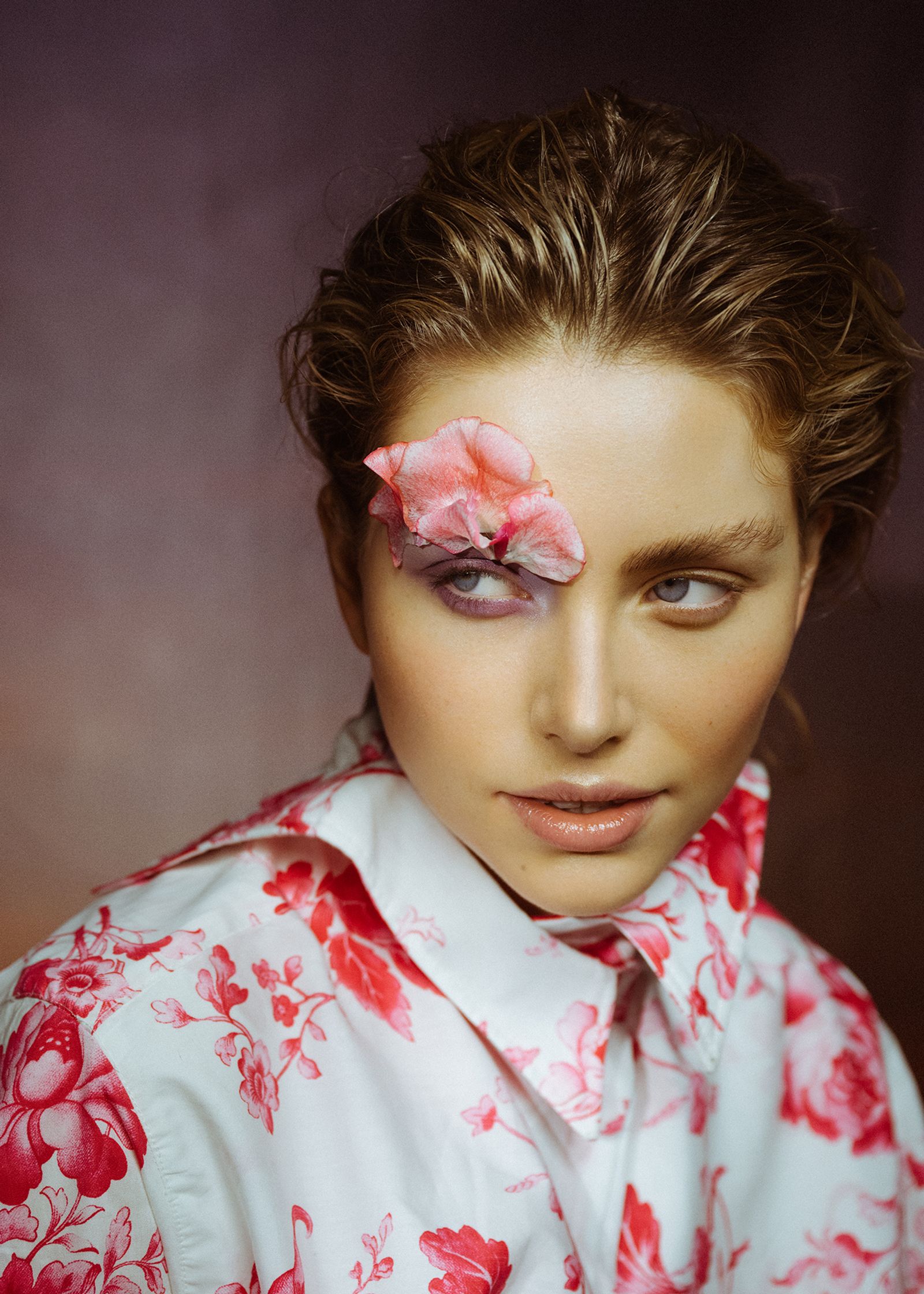 a woman with a flower on her face