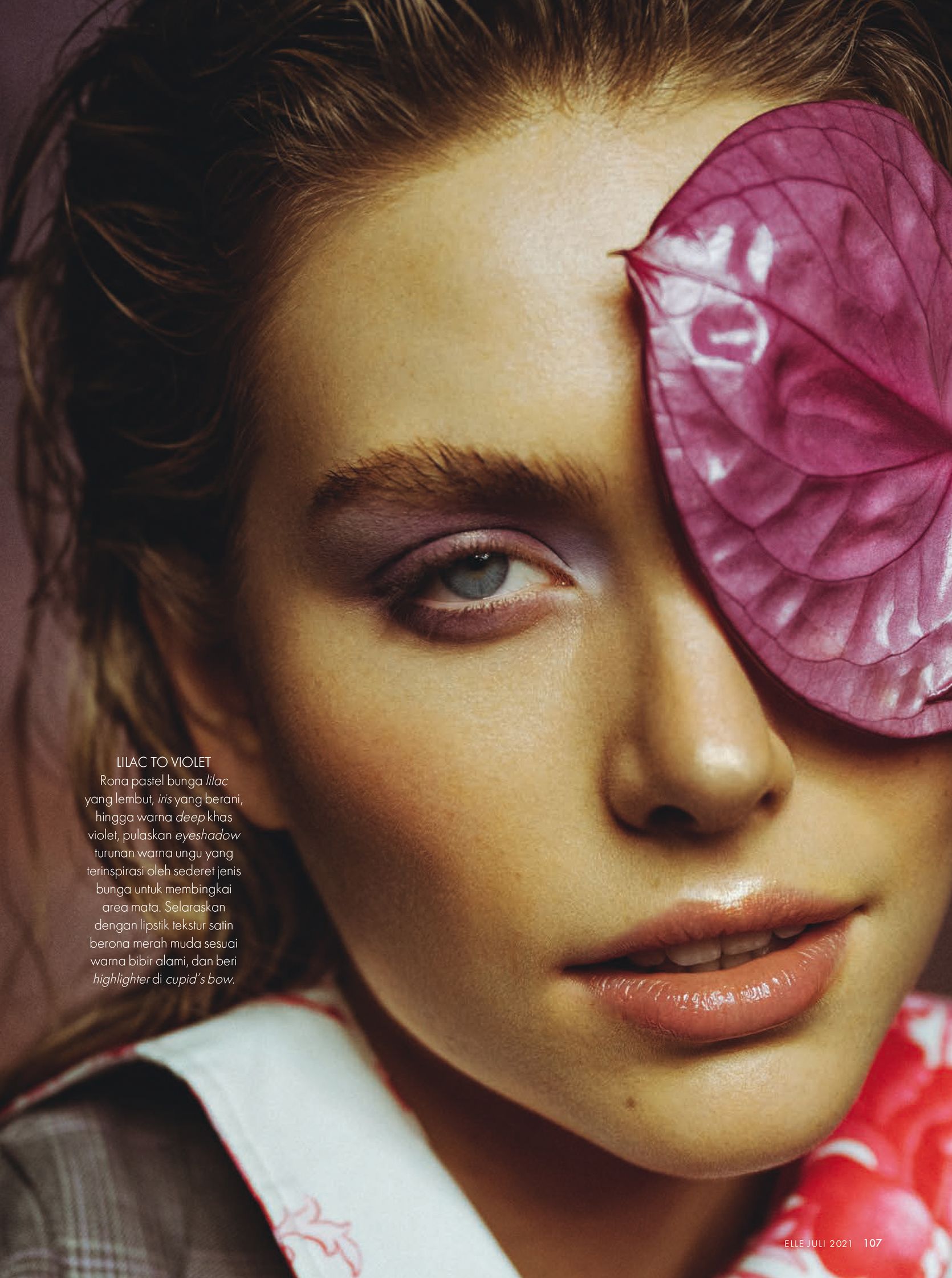 a woman with a flower on her face