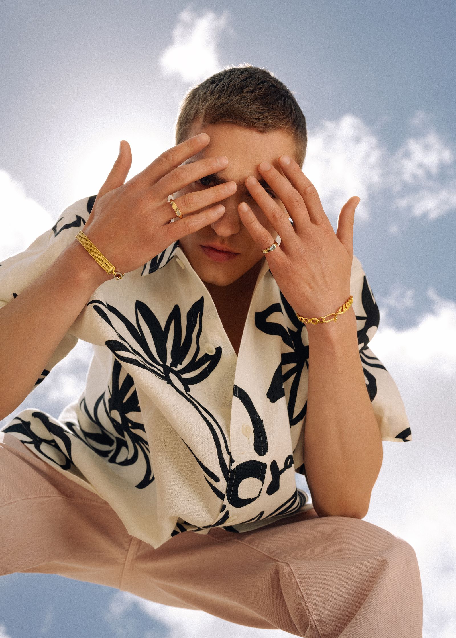 a man with his hands covering his eyes