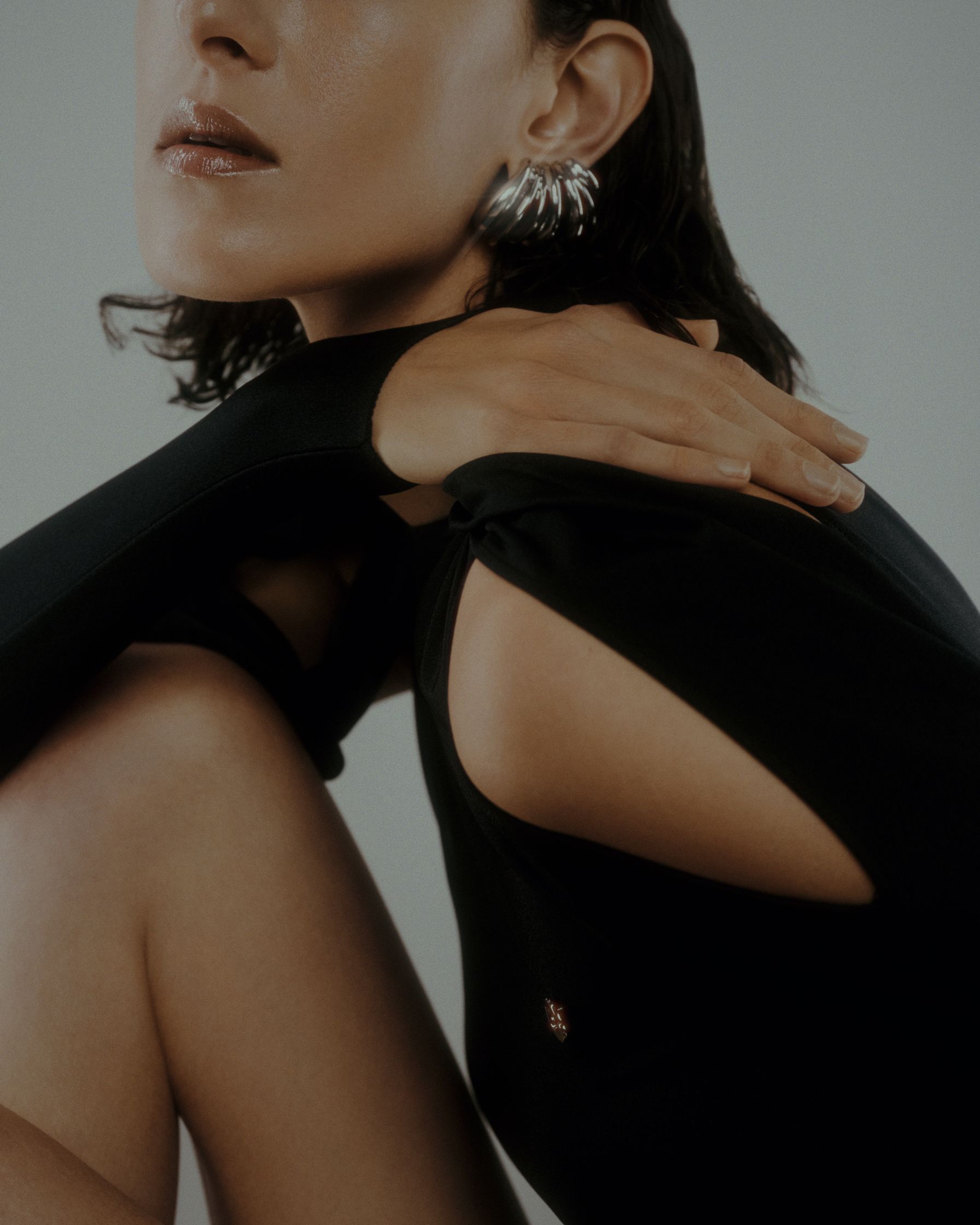 a woman in a black top posing for a photo