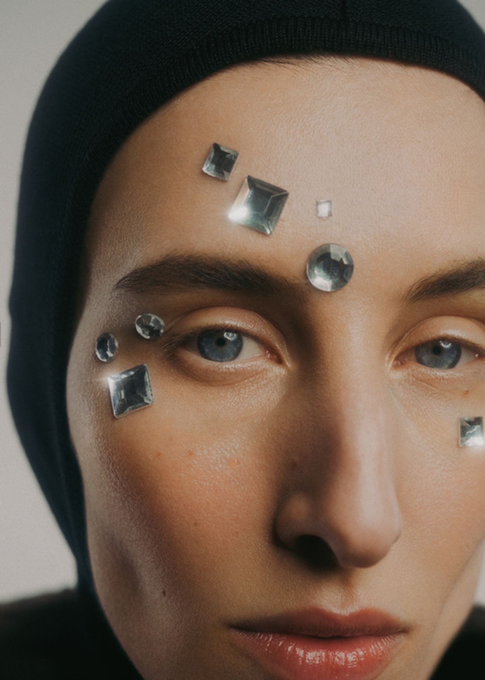 a woman with diamonds on her face
