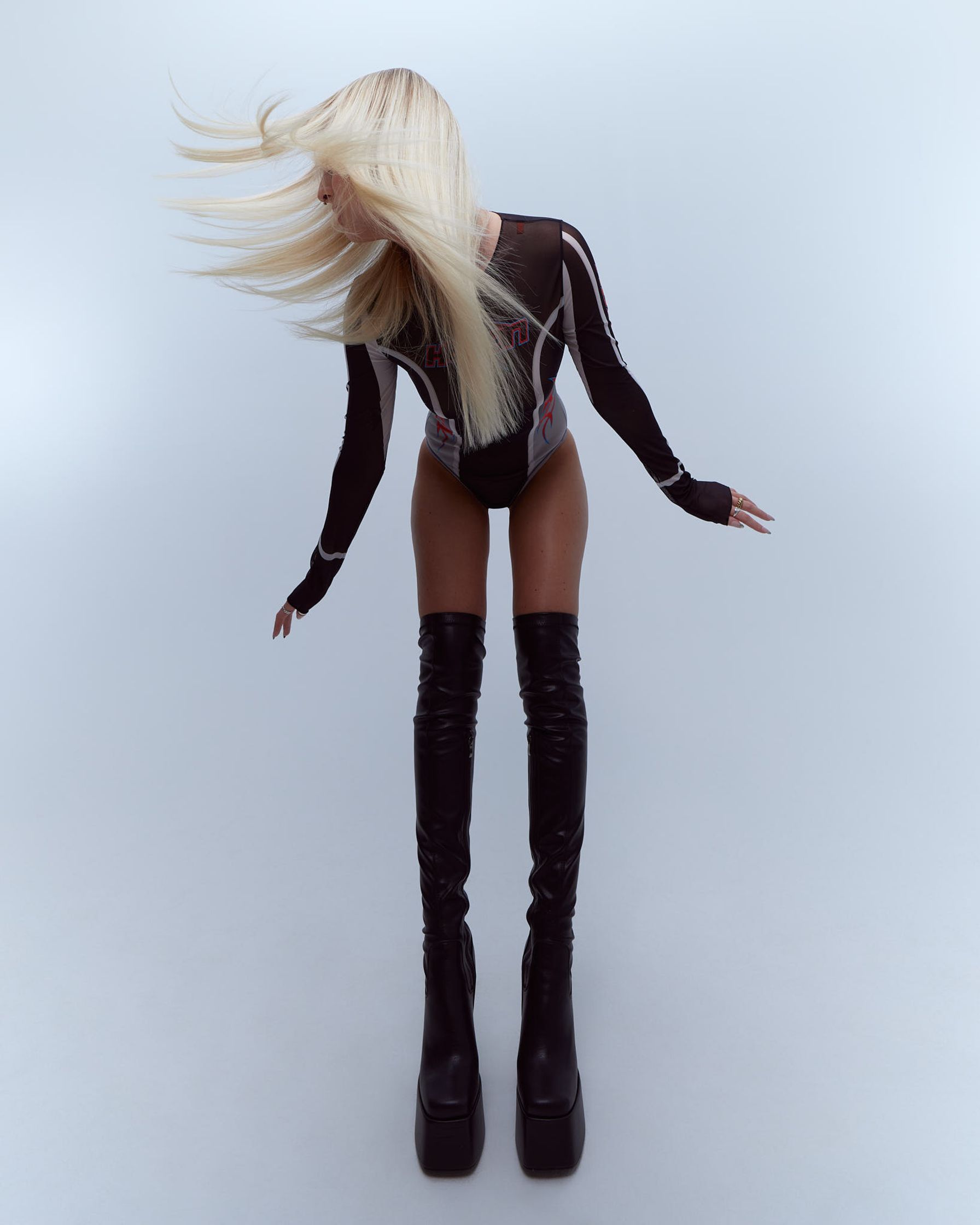 a 3d model of a woman in black boots