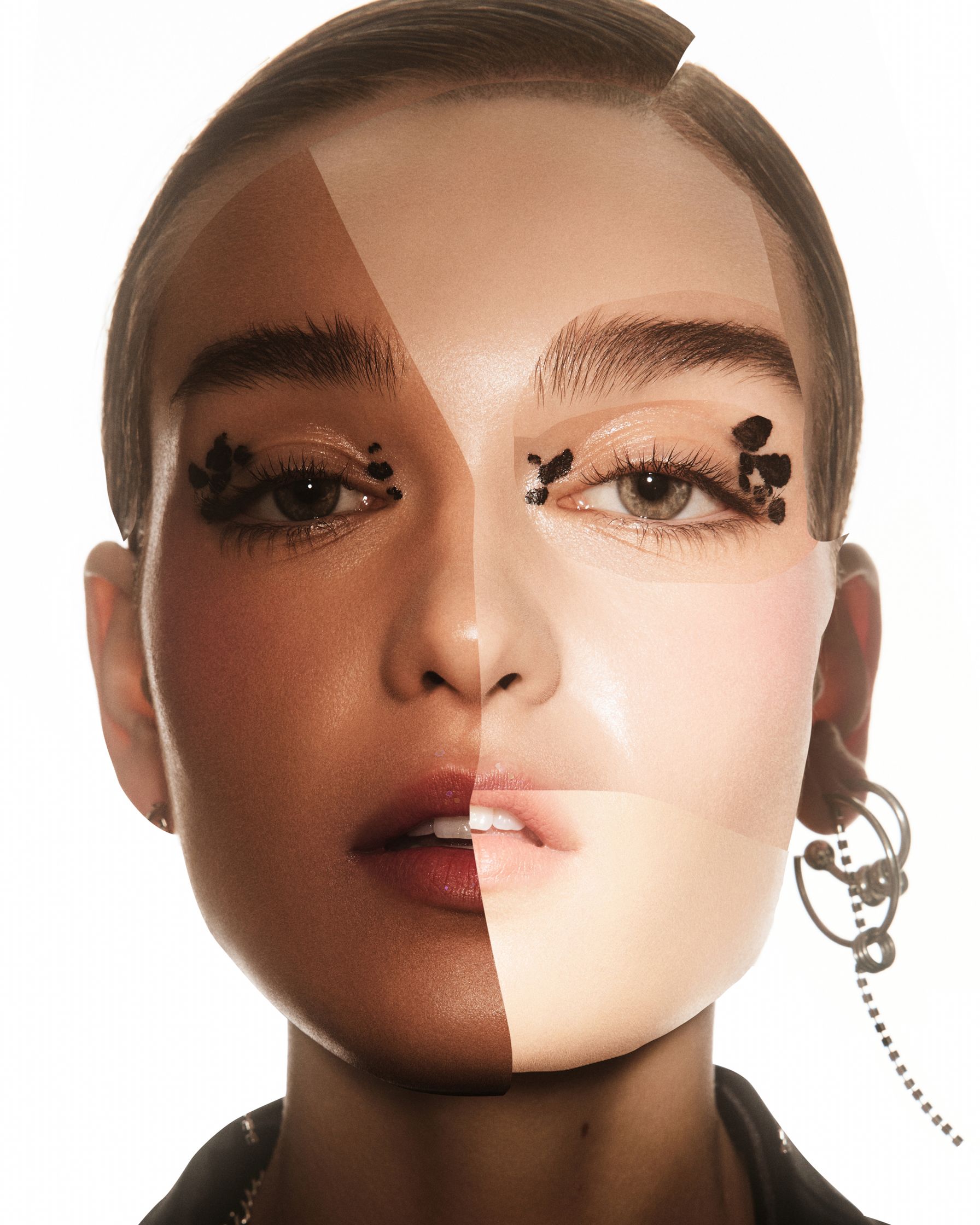 an image of a woman's face with earrings on it