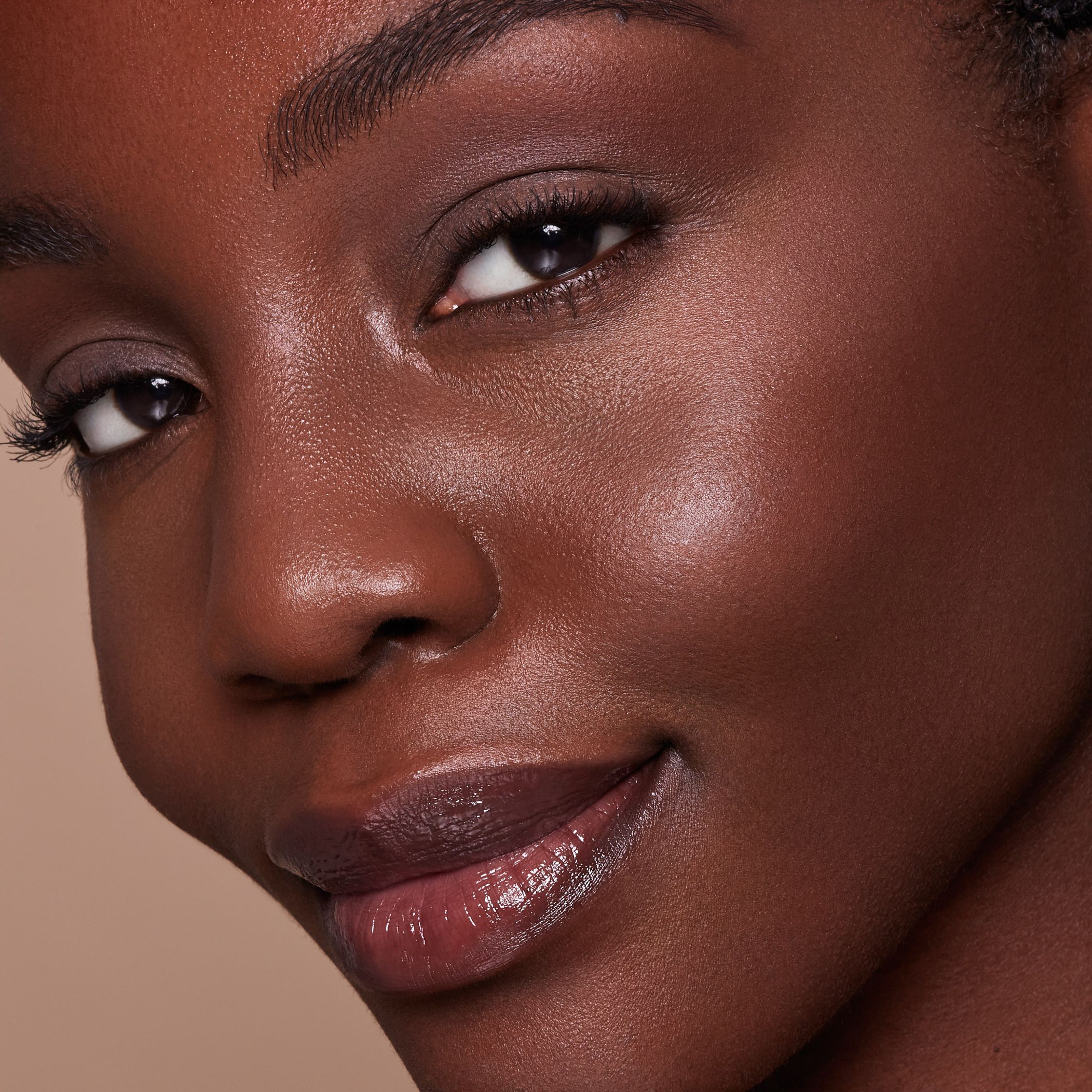 a close up of a woman with dark brown skin