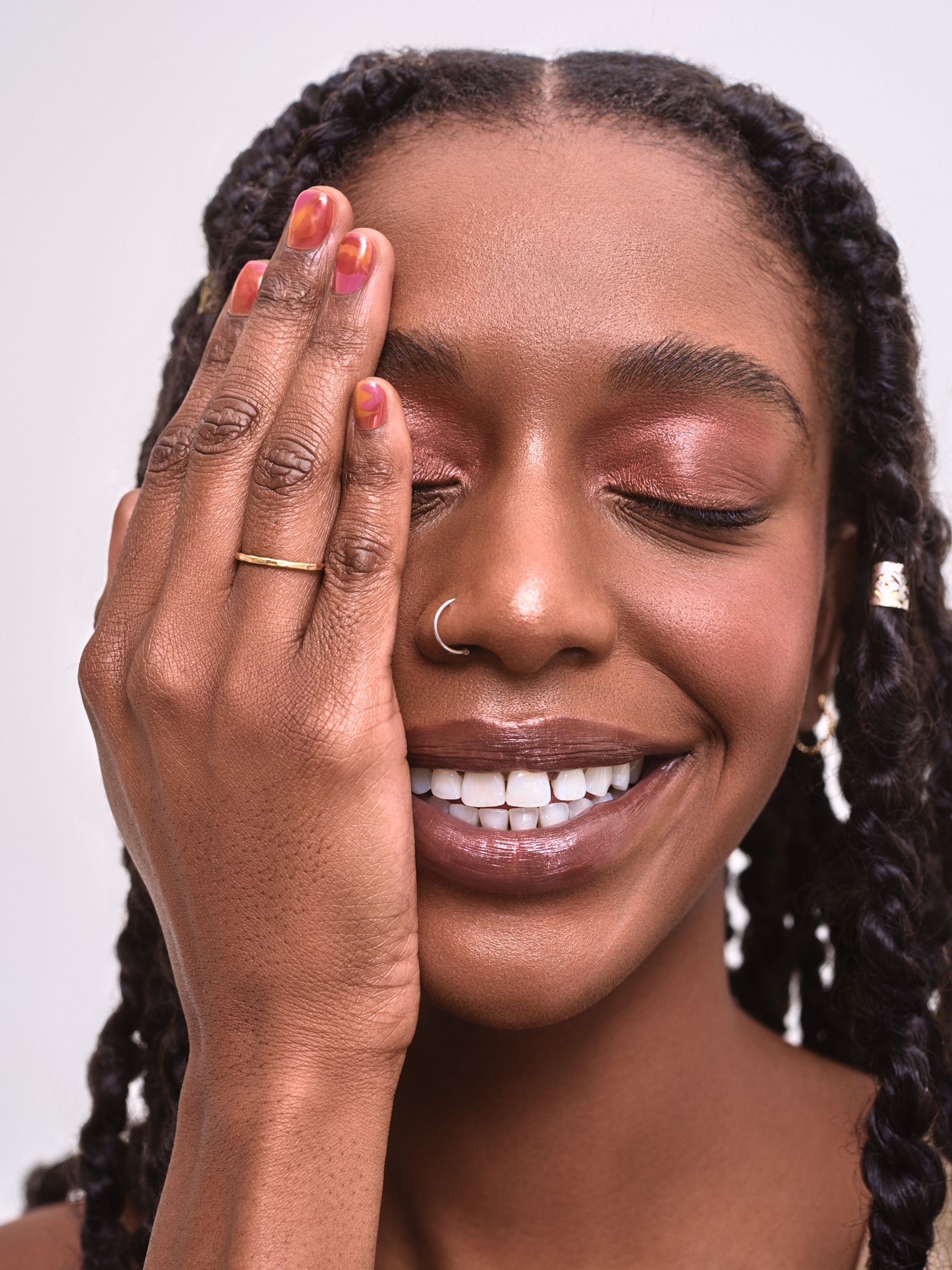 a black woman with dreadlocks and a ring on her finger