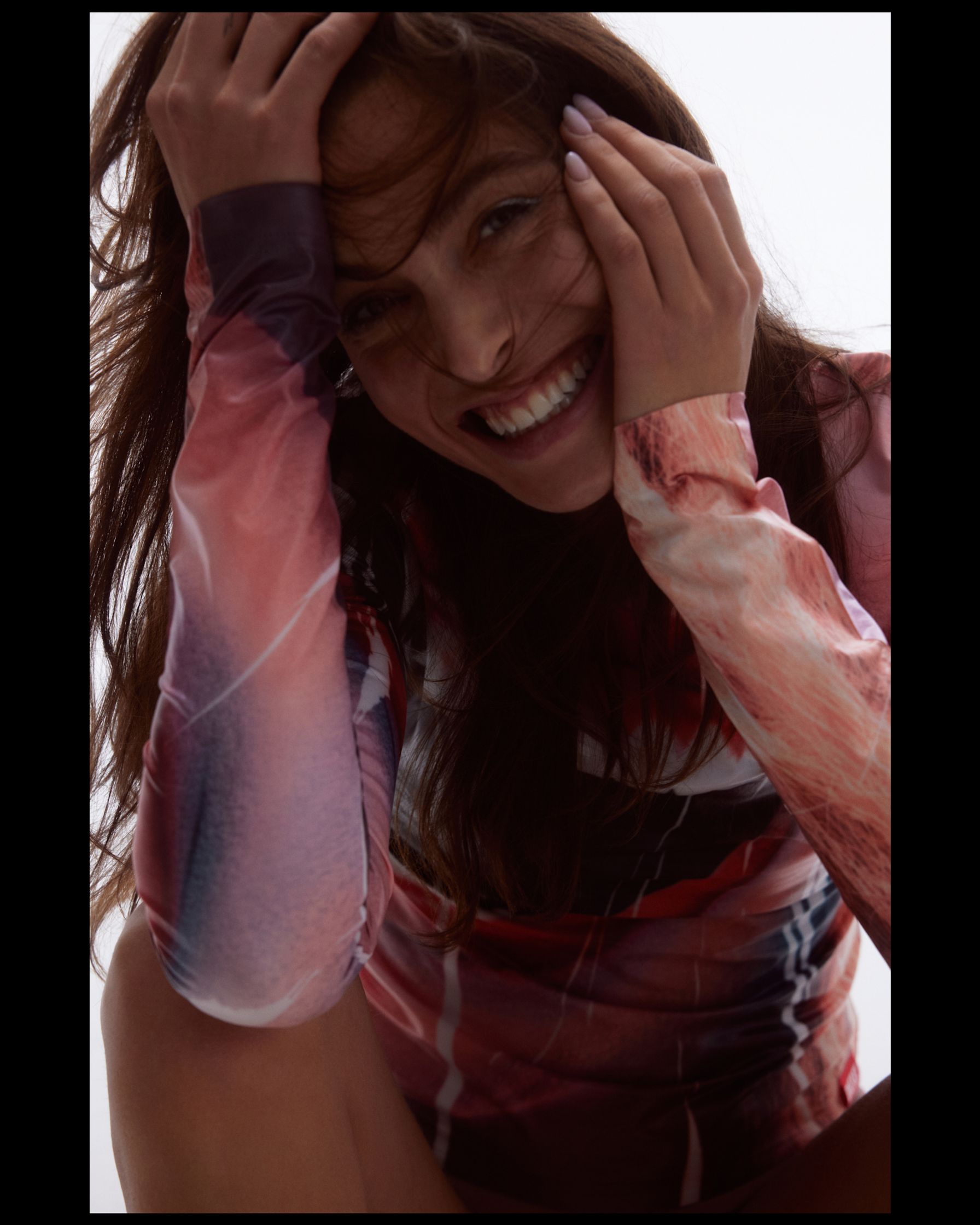 a woman wearing a long - sleeved shirt