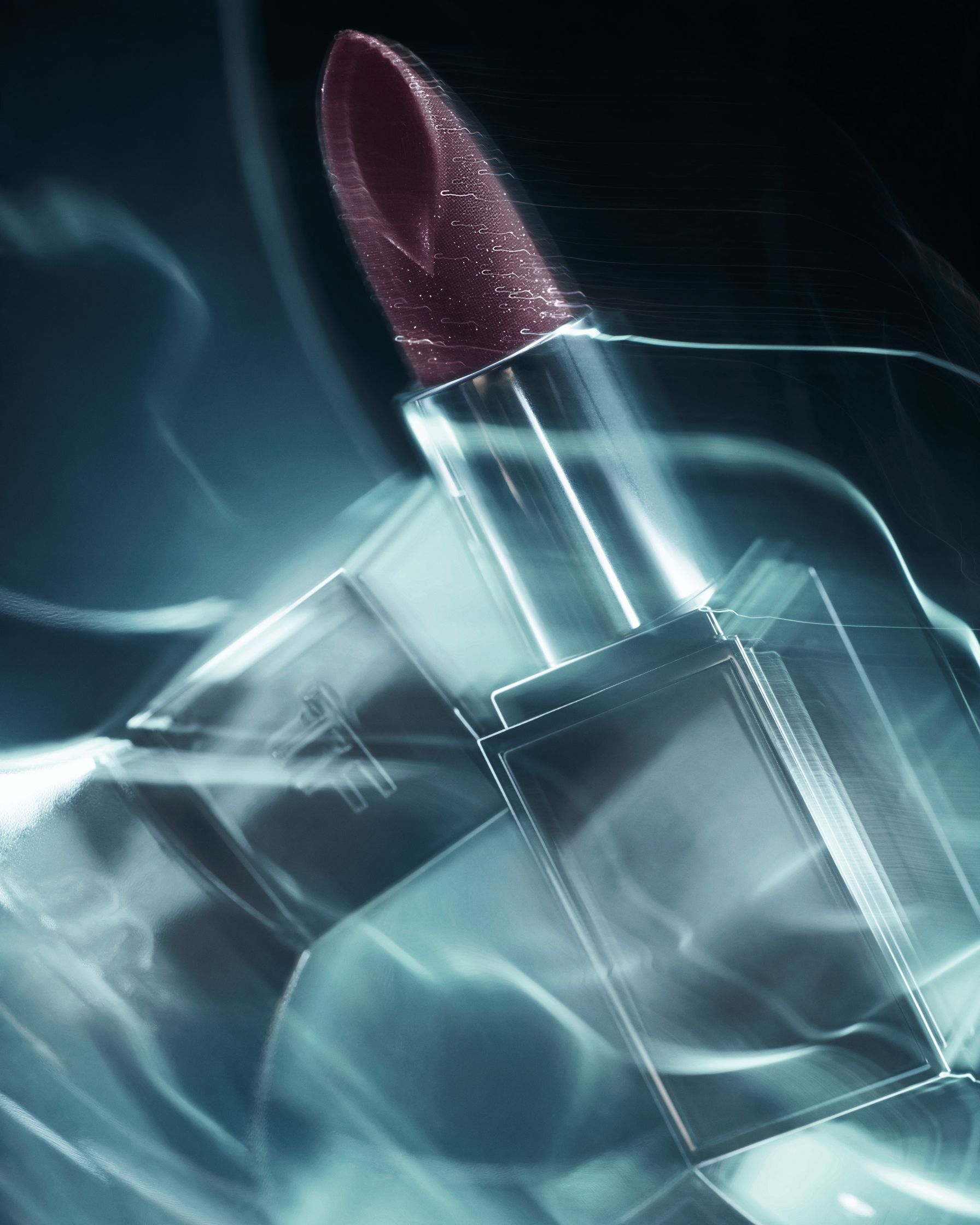 om Ford lipstick with shimmering particles, captured in a dynamic, abstract composition that highlights the product's rich color and cosmic texture.