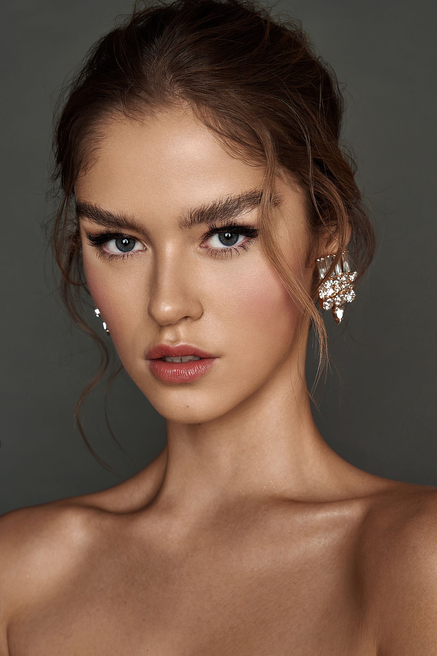 a model in a strapless dress posing for a photo