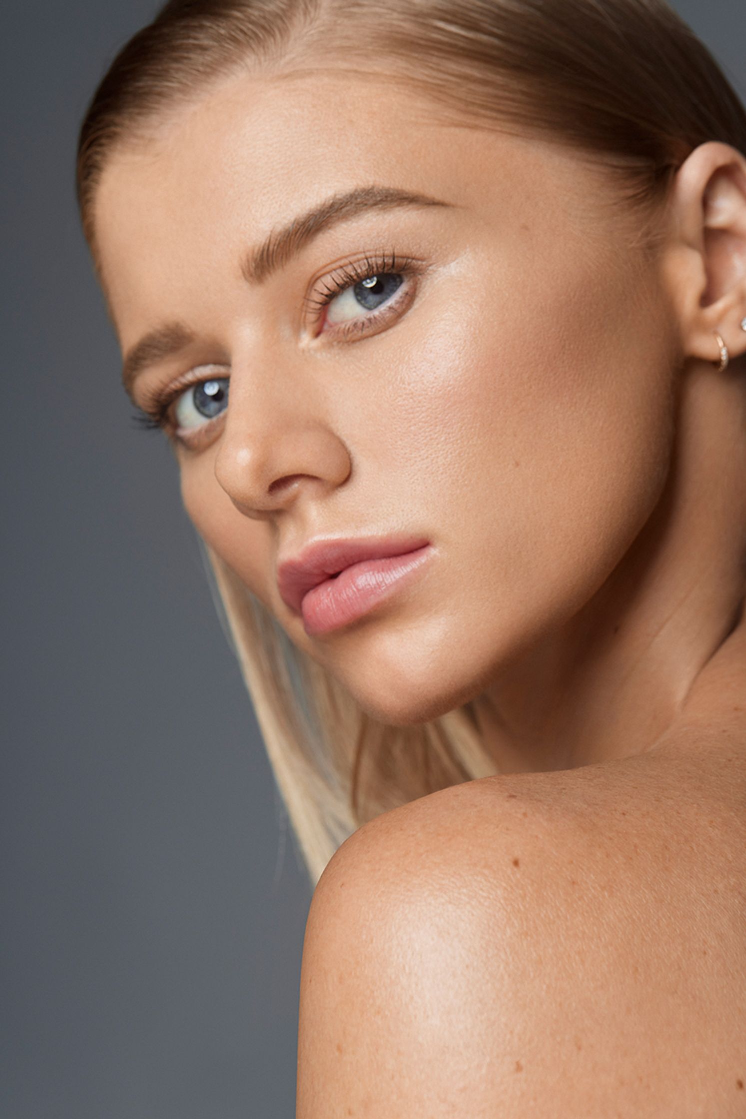 a woman with blue eyes posing for a photo