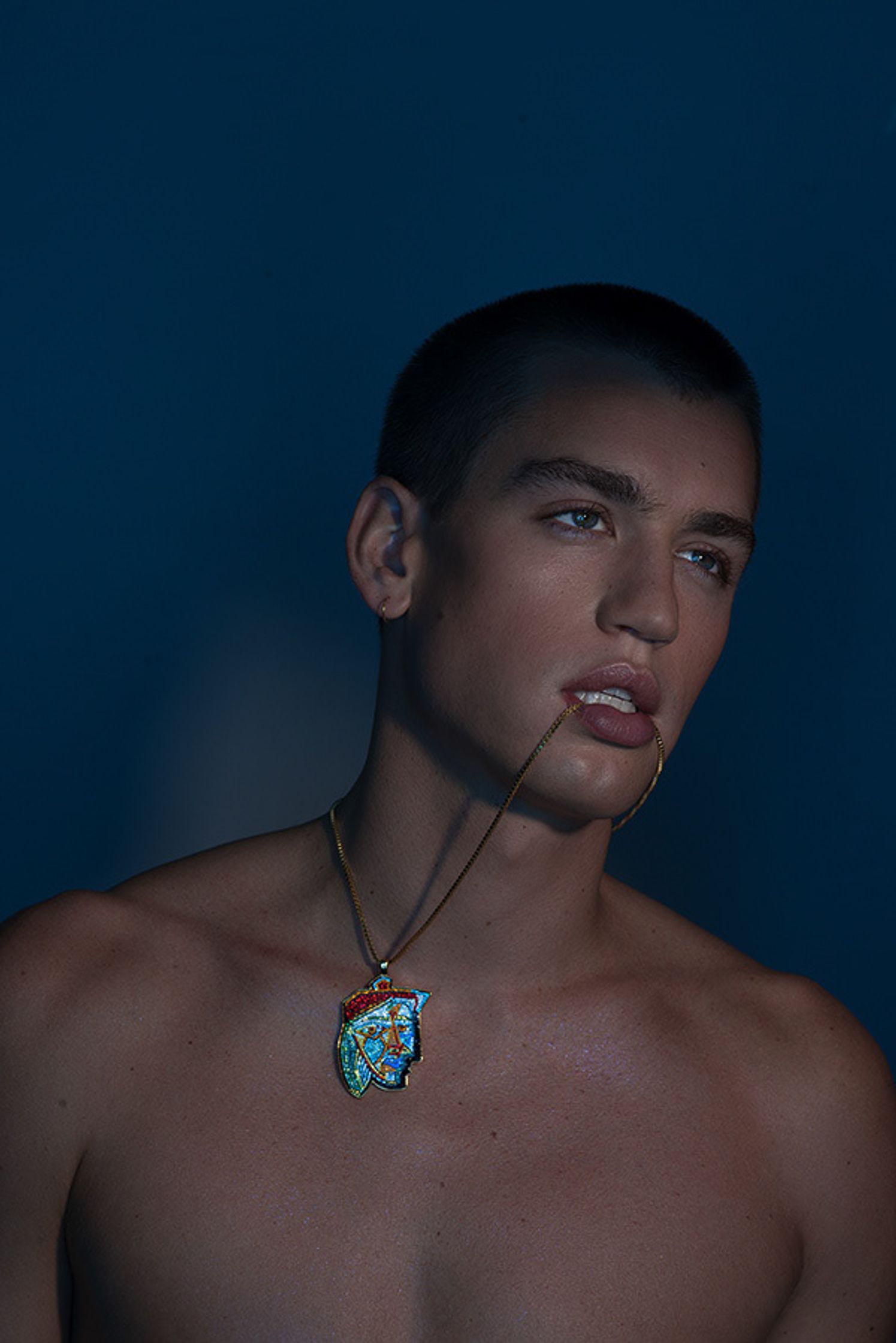 a man with a necklace on his neck