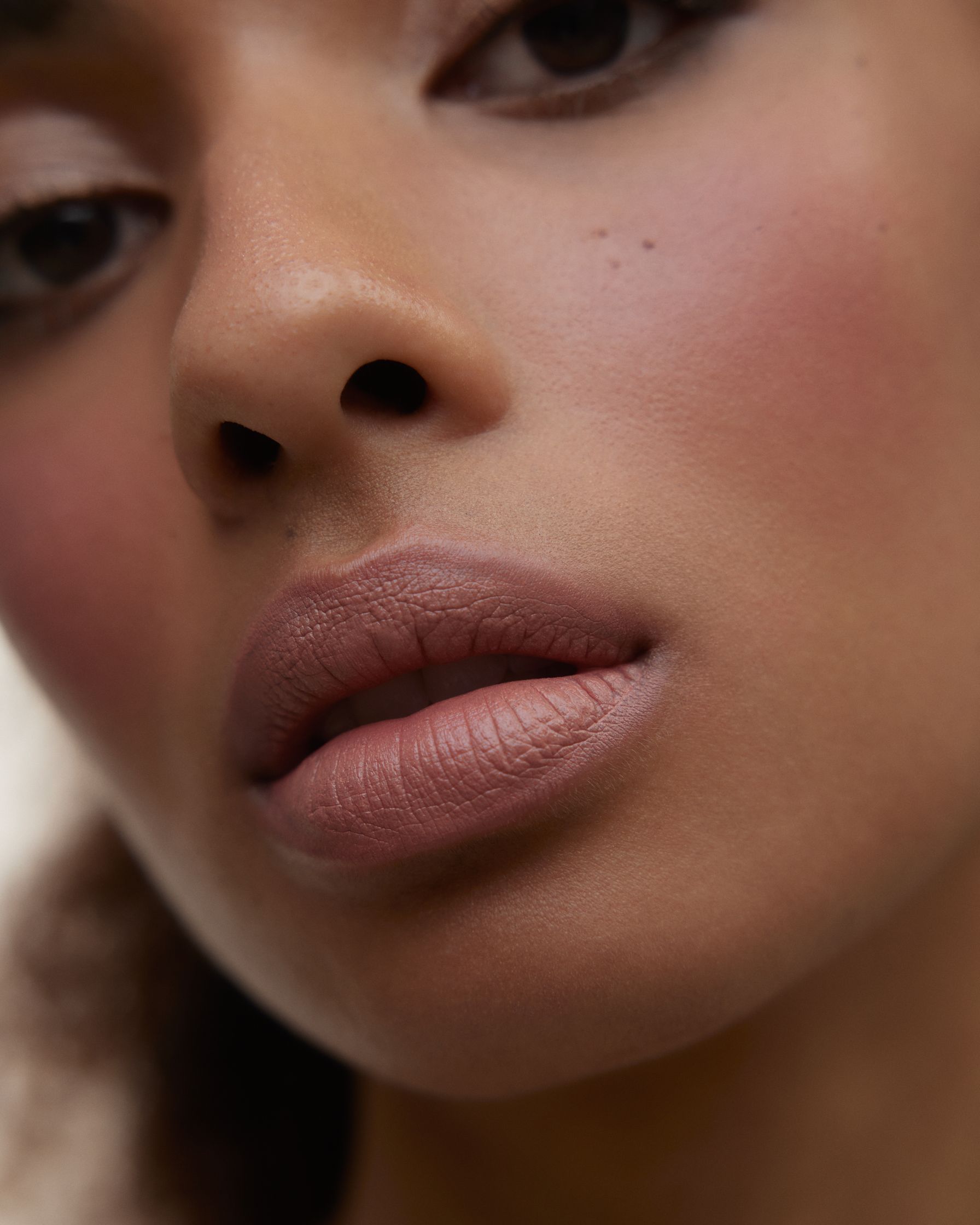 a close up of a woman with dark brown eyes