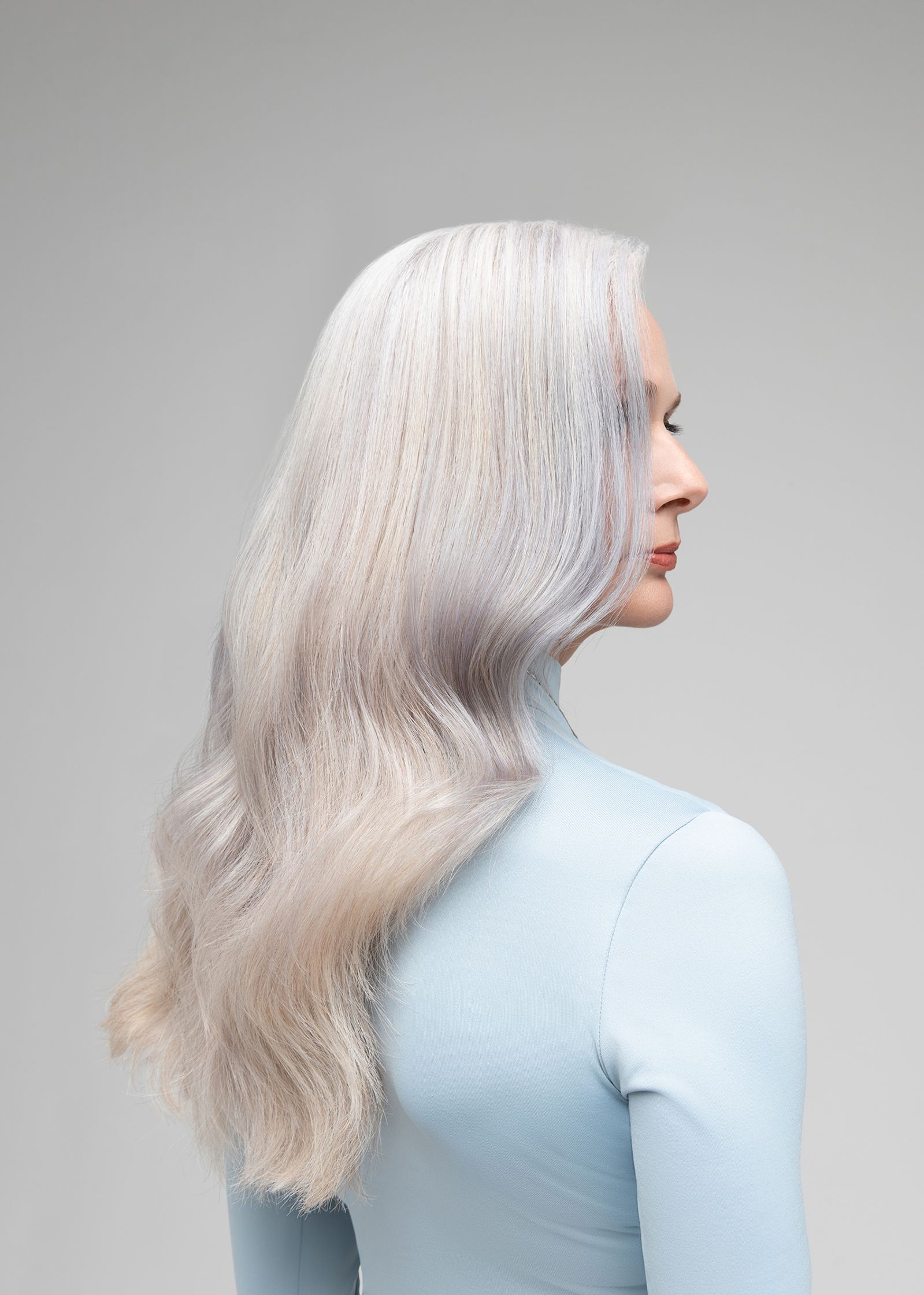 the back of a woman with long blonde hair
