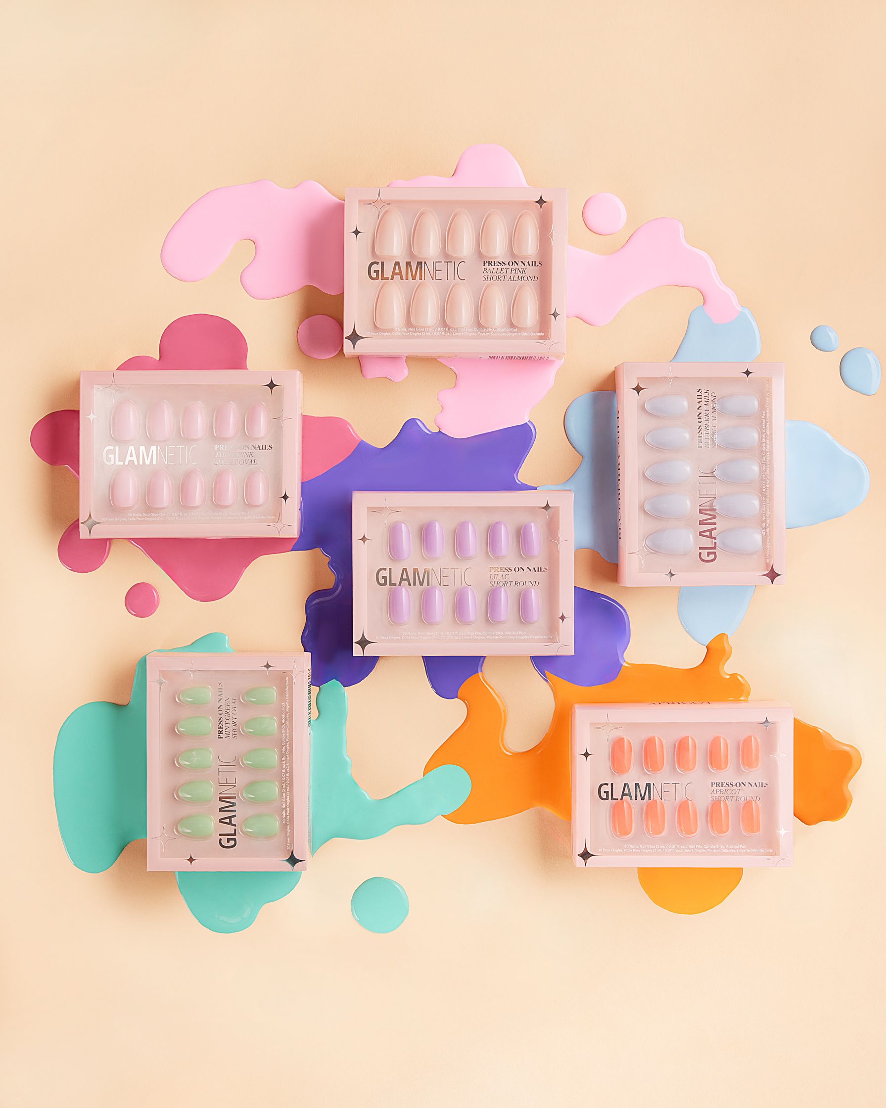 glam nail polishes on a colorful background
