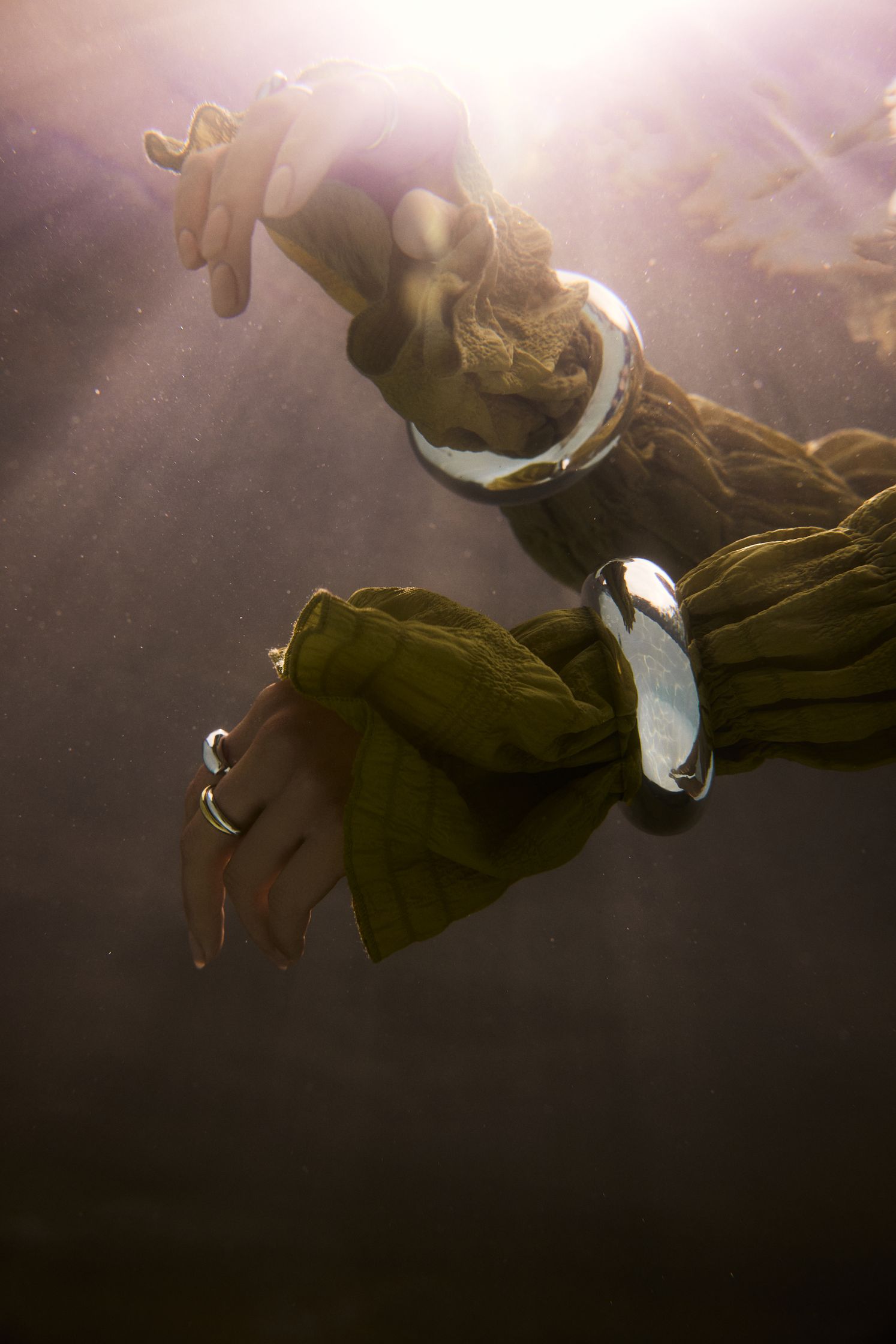 a woman's hand in the water