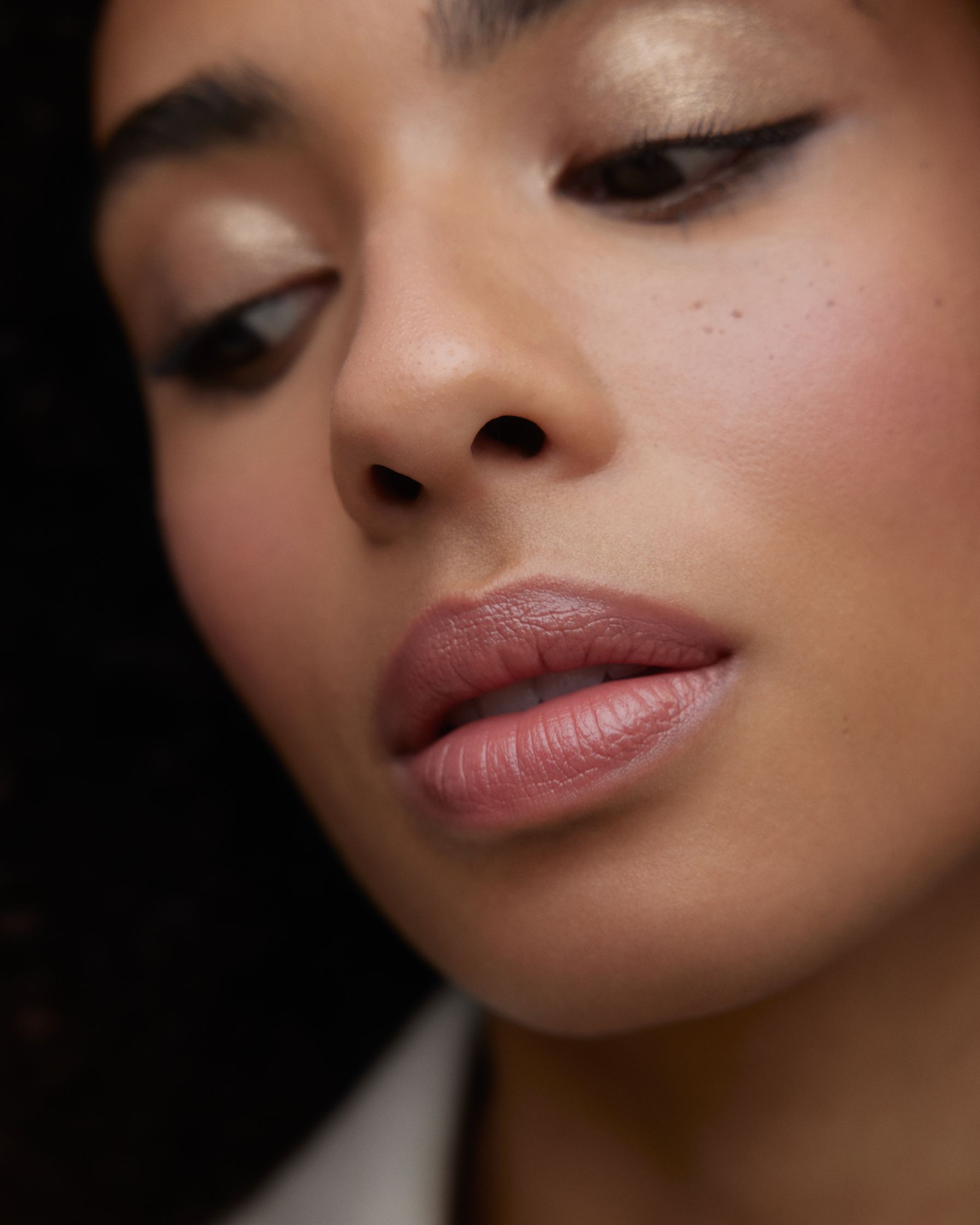 a close up of a woman with curly hair