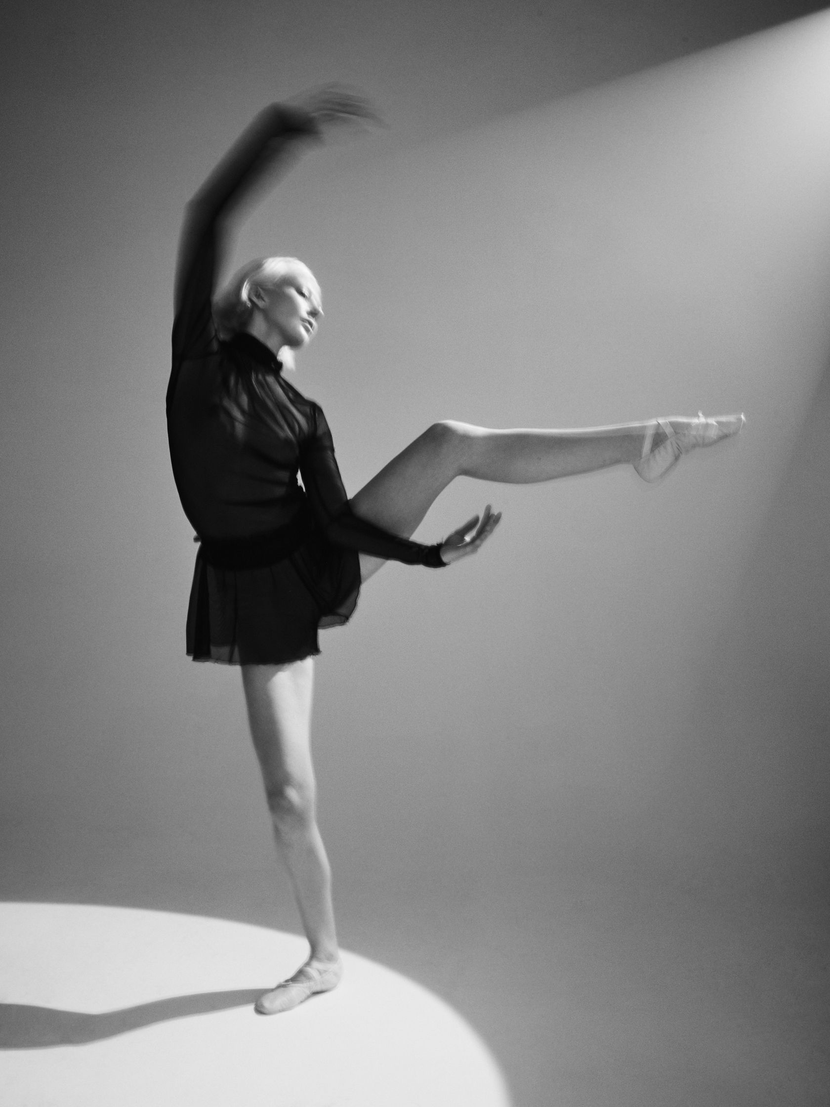 a black and white photo of a dancer