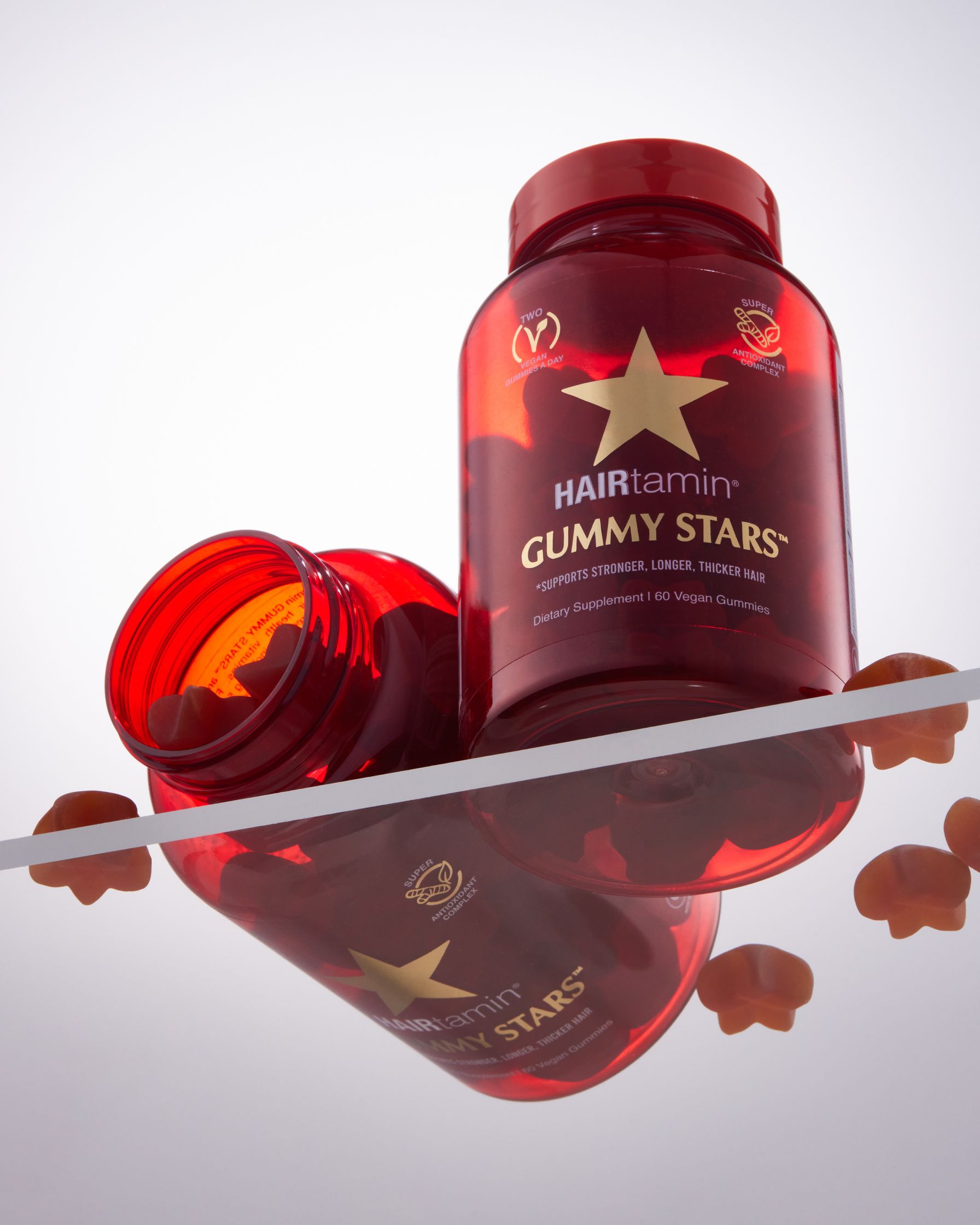 a bottle of gummy stars sitting on a table