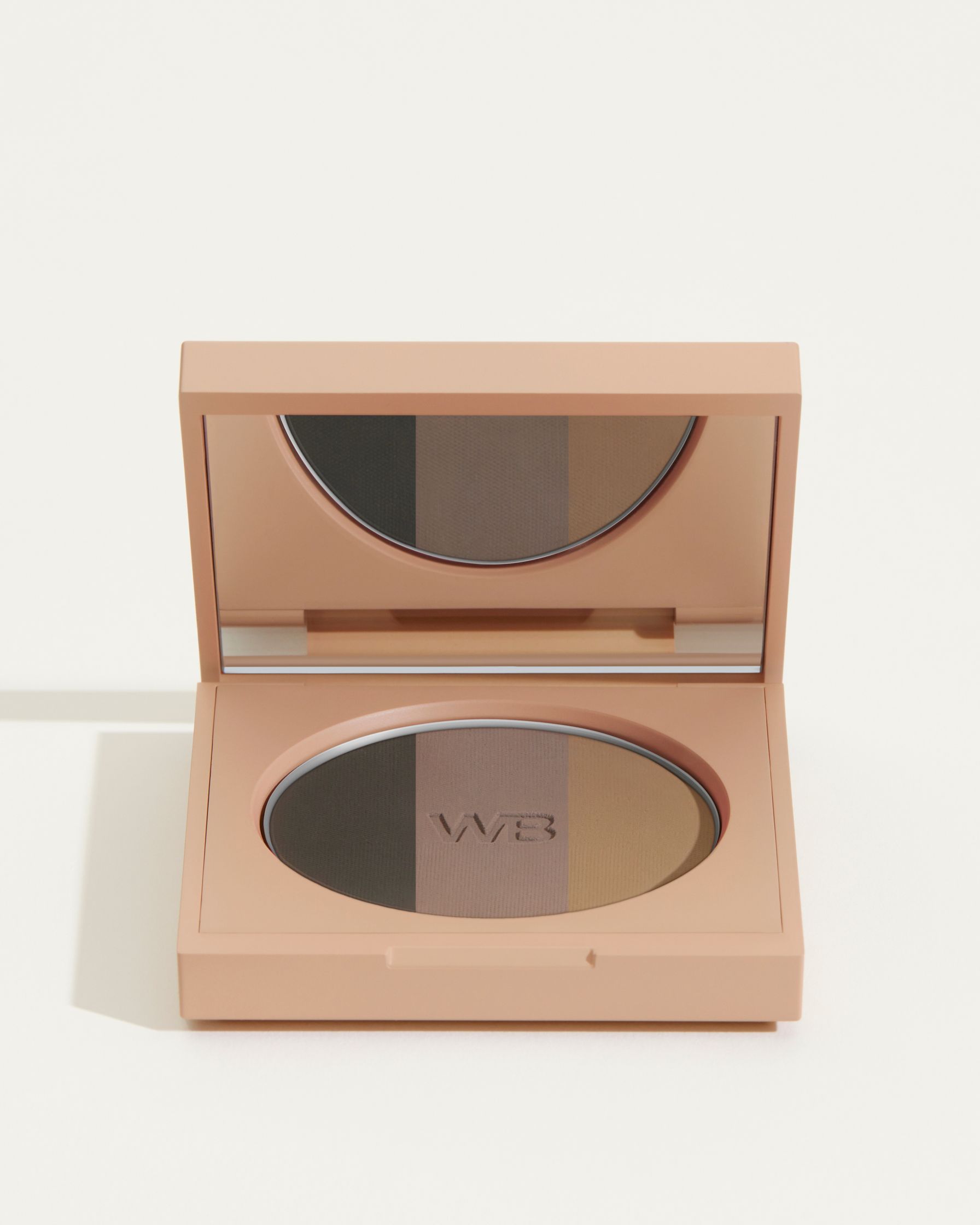 a compact eyeshadow palette on a white surface
