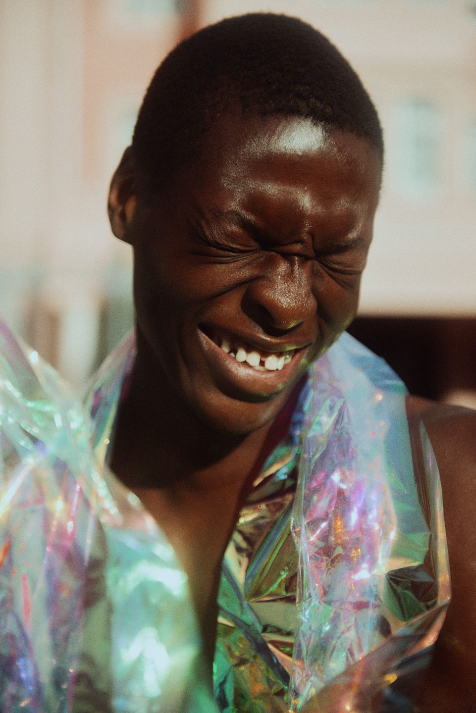 a young black man wearing a colorful jacket by Martin Kula