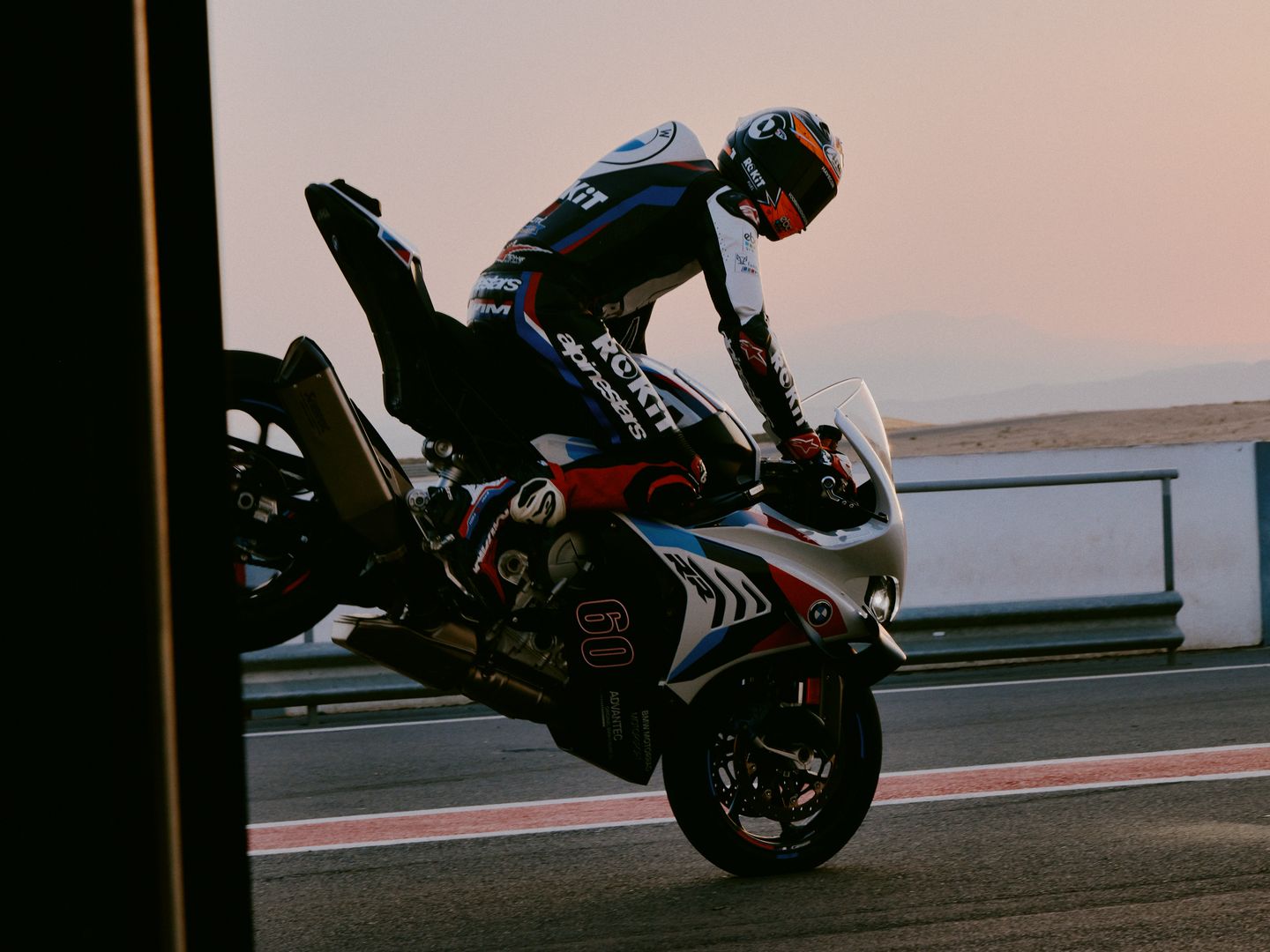 a BMW motorcycle rider doing a stunt on a motorcycle photographed by advertising photographer Martin Kula
