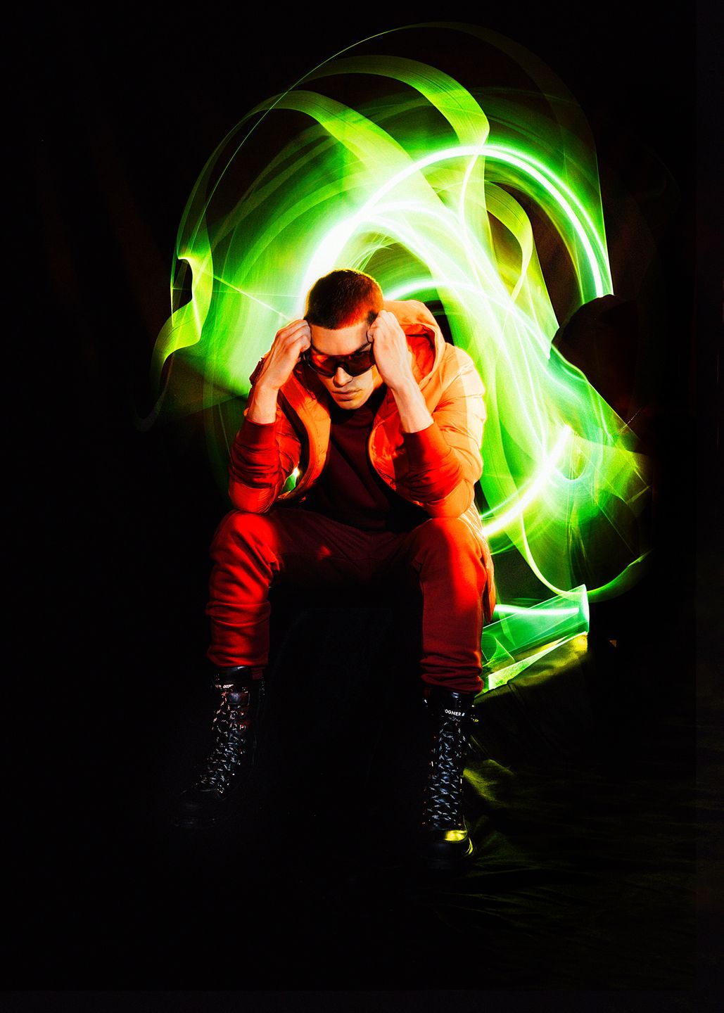 a man wearing a red jacket by Martin Kula, photographer