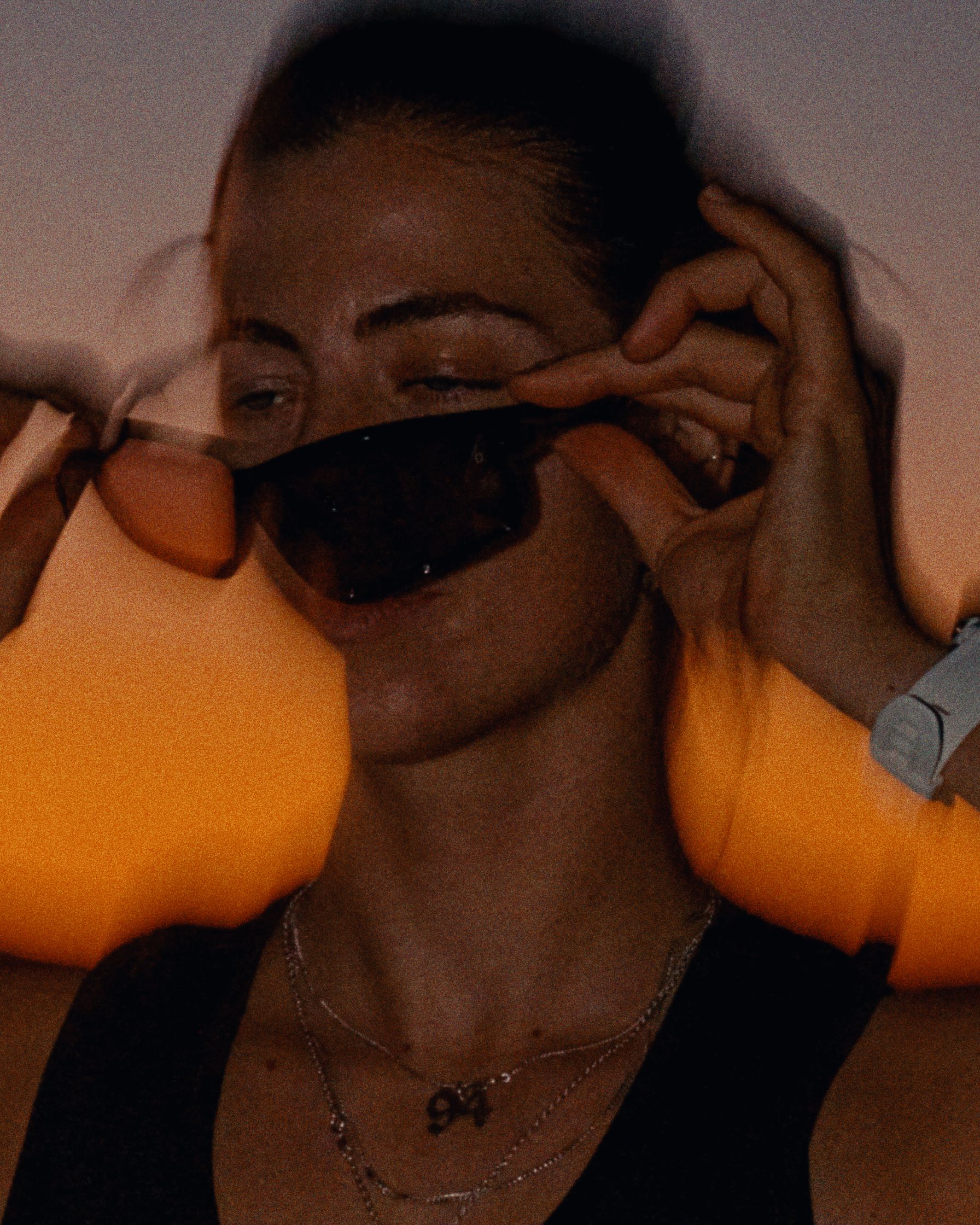 a woman wearing sunglasses at sunset