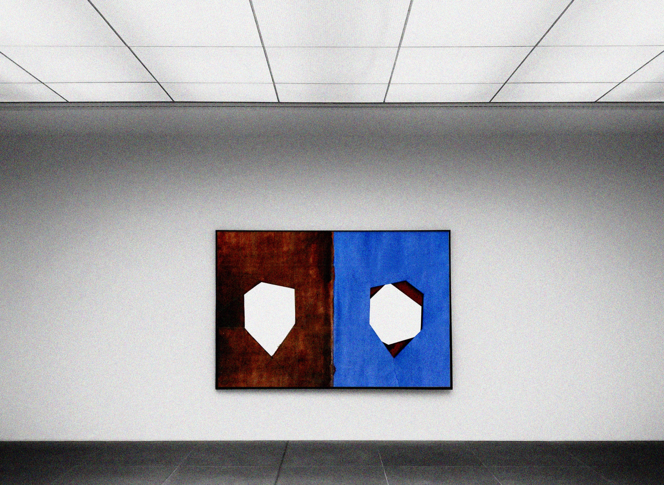 a painting hanging on a wall in an empty room