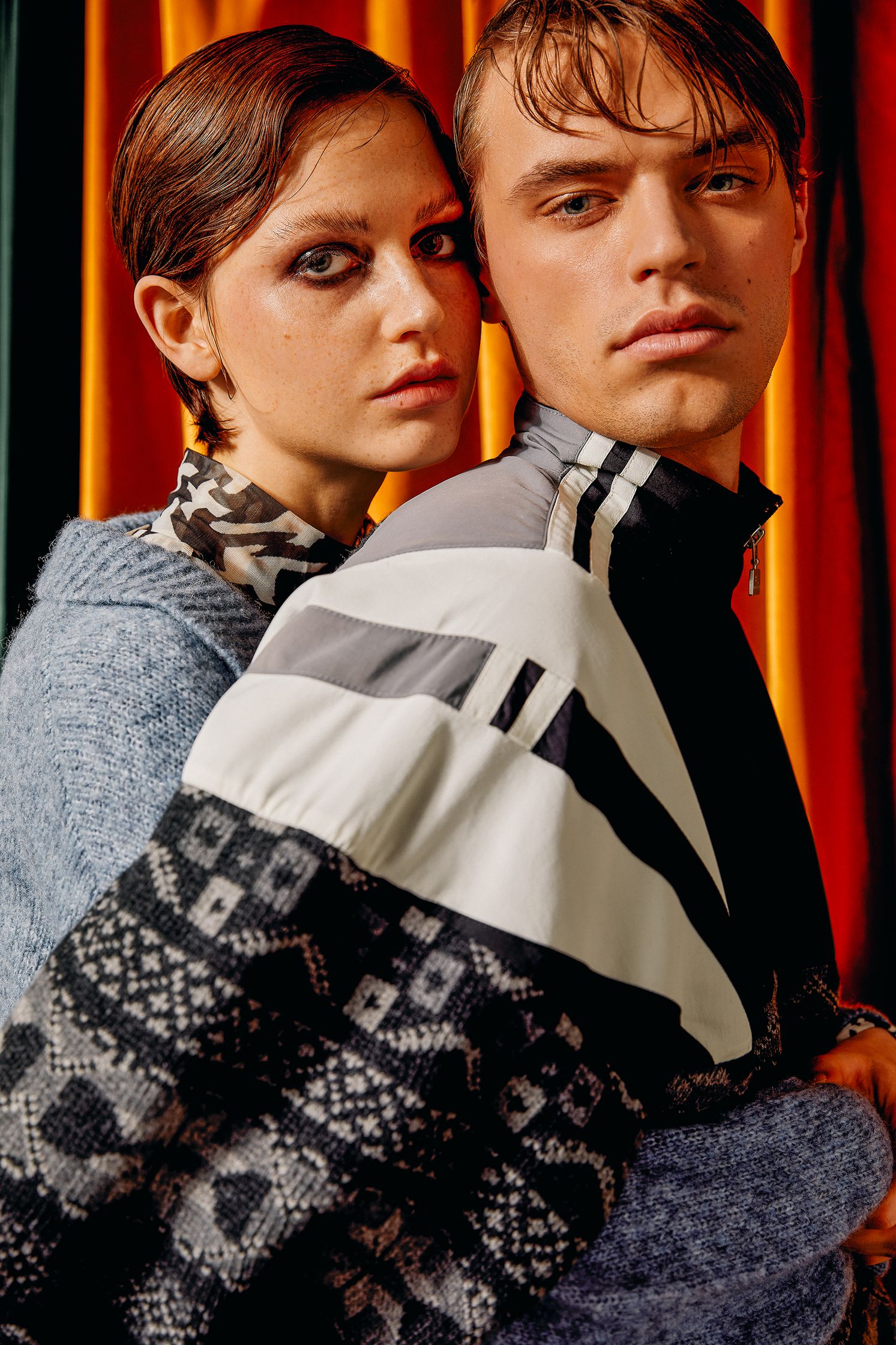 a man and a woman posing for a magazine