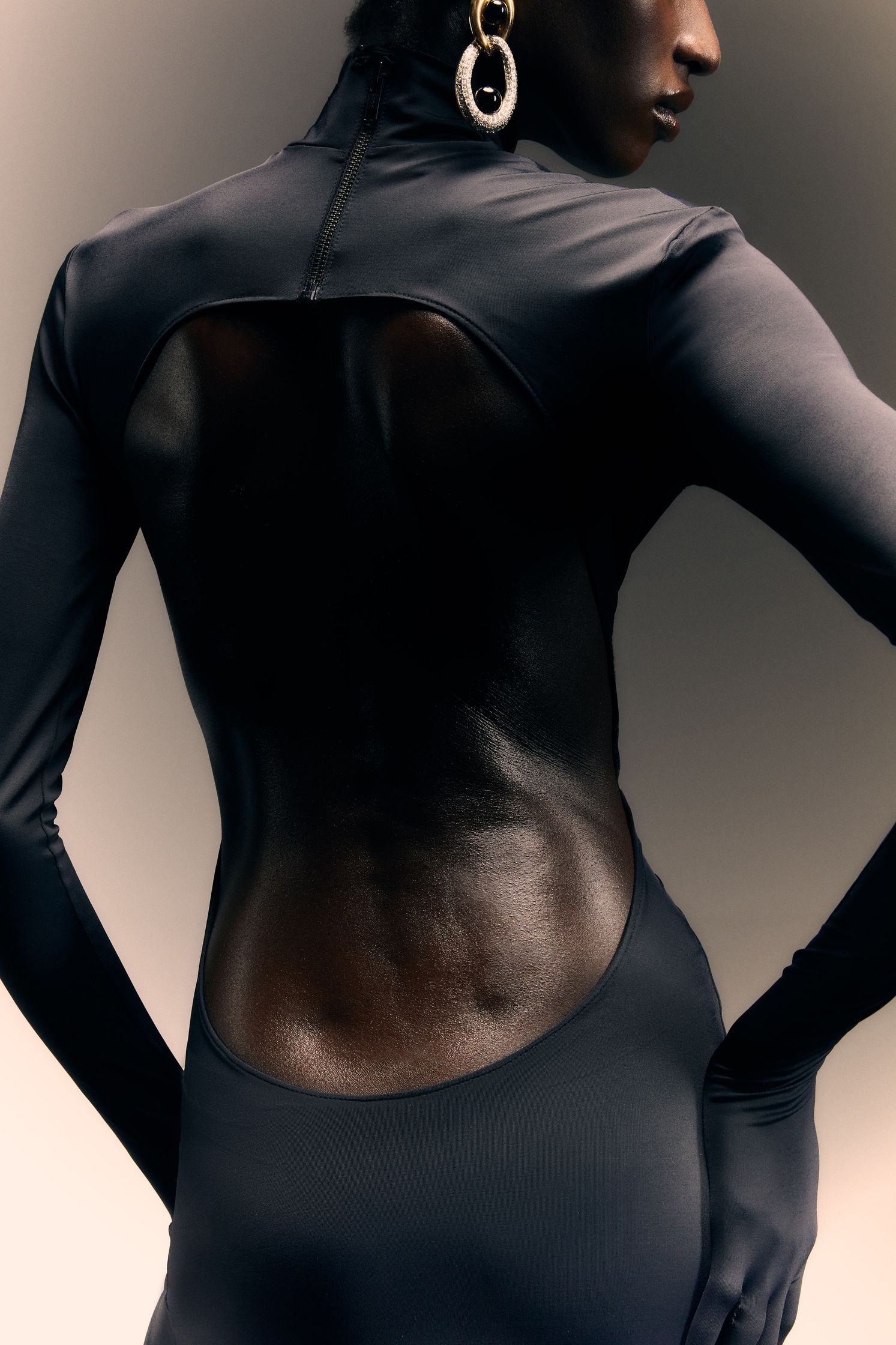 the back of a woman in a black dress