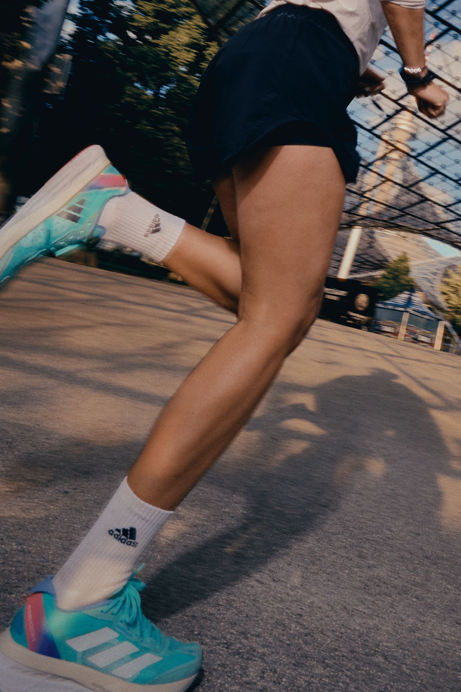 a woman running in a pair of adidas running shoes