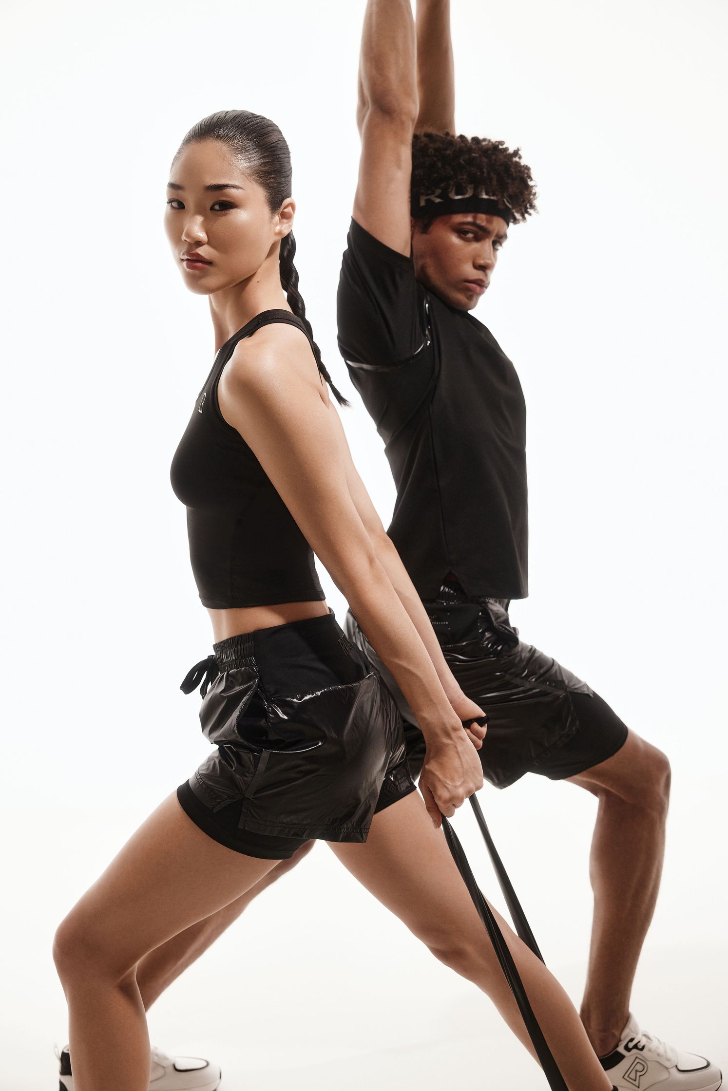 a man and a woman doing exercises on a white background