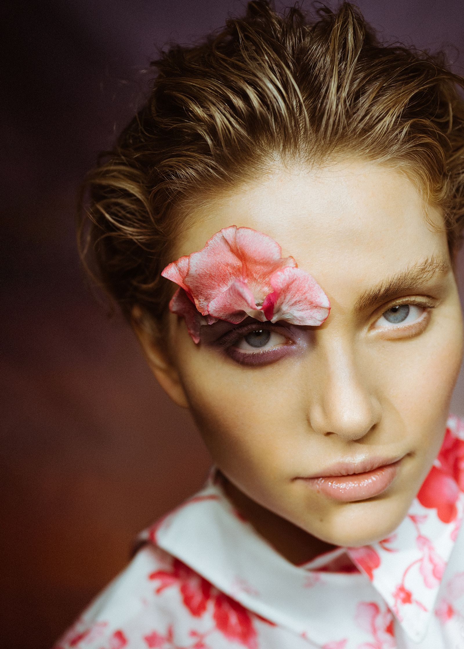 a woman with a flower on her face