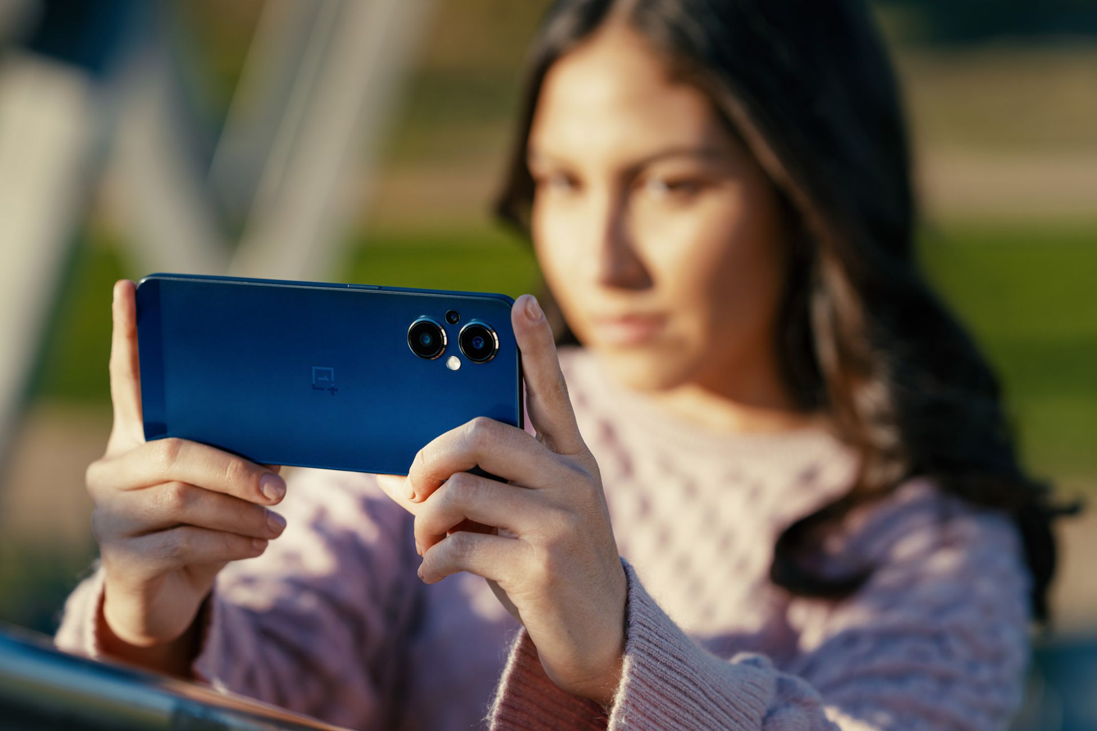 Girl holding OnePlus phone