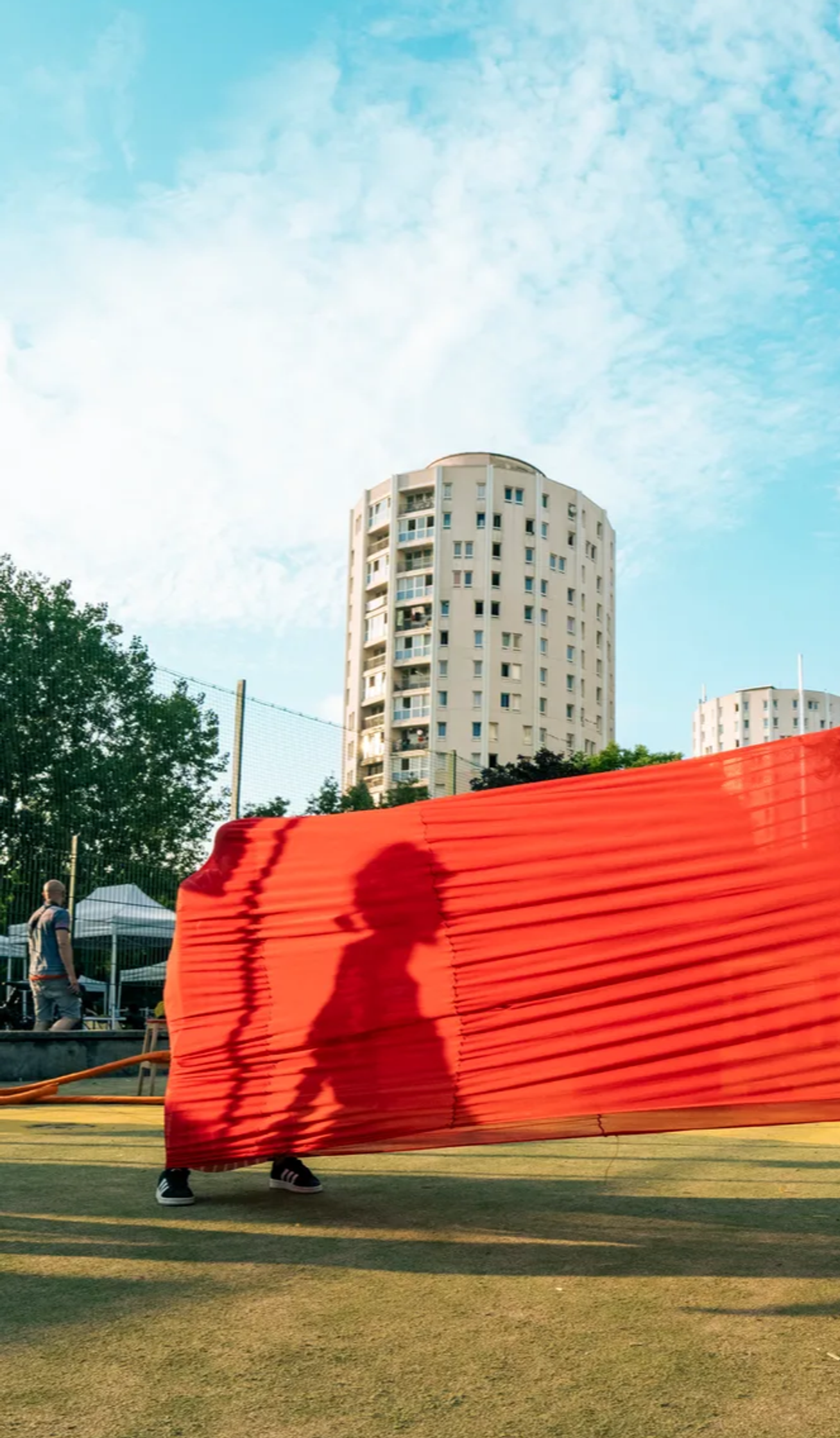 shadow of a woman on a red tissu