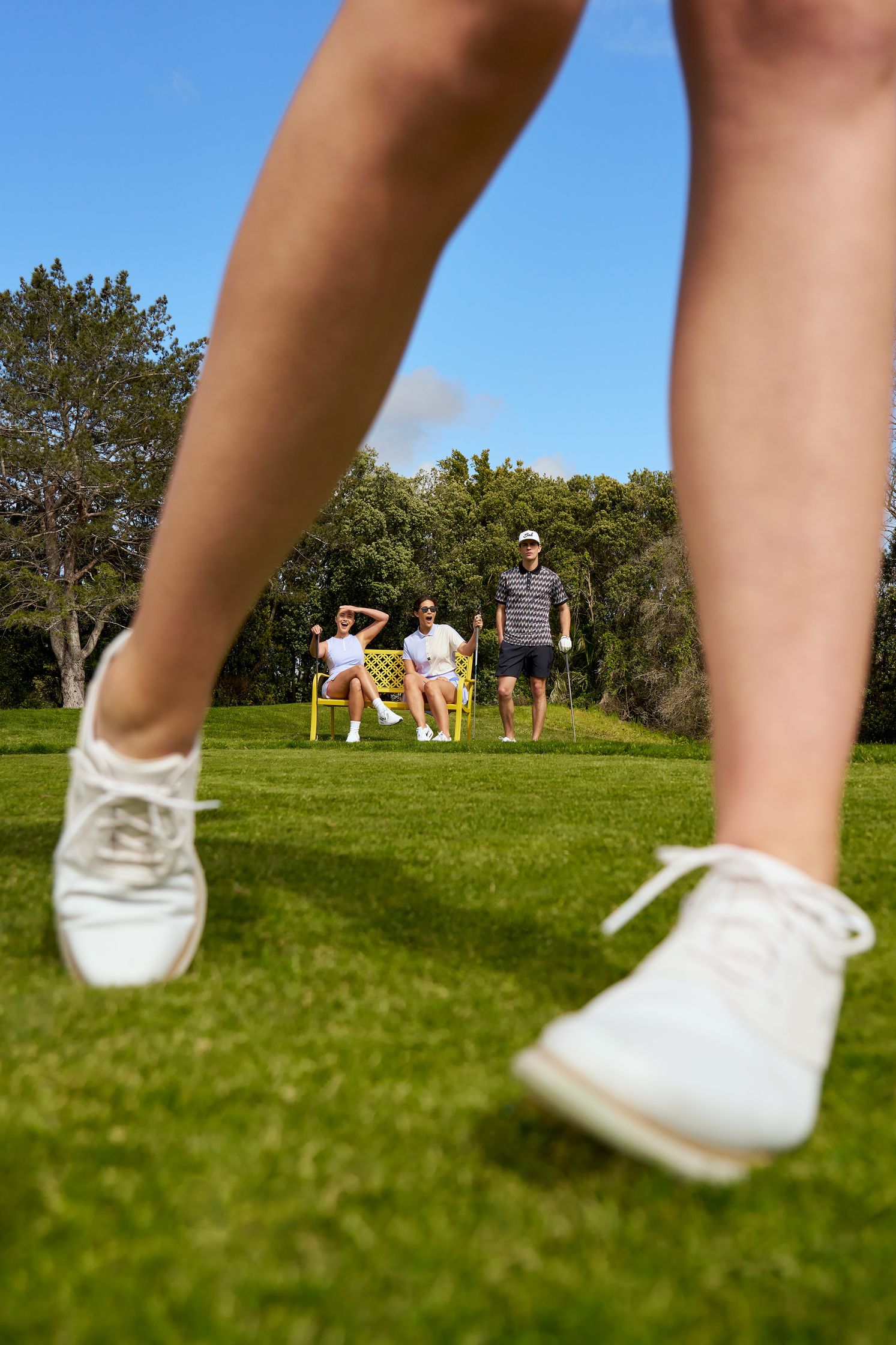 a woman's legs on a golf course