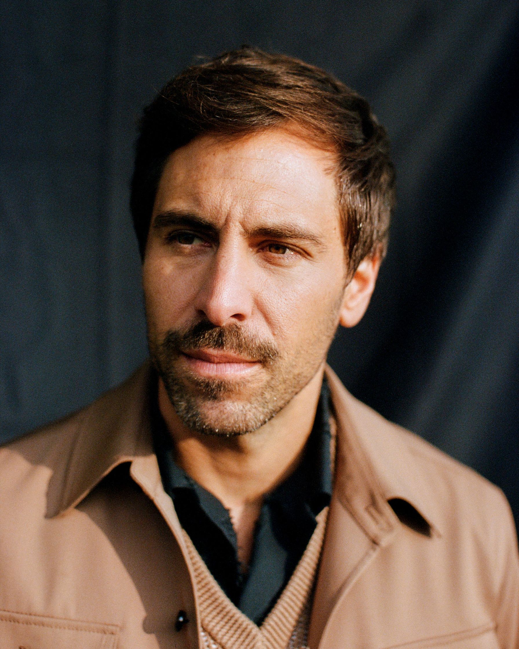 Max Giesinger in a tan jacket