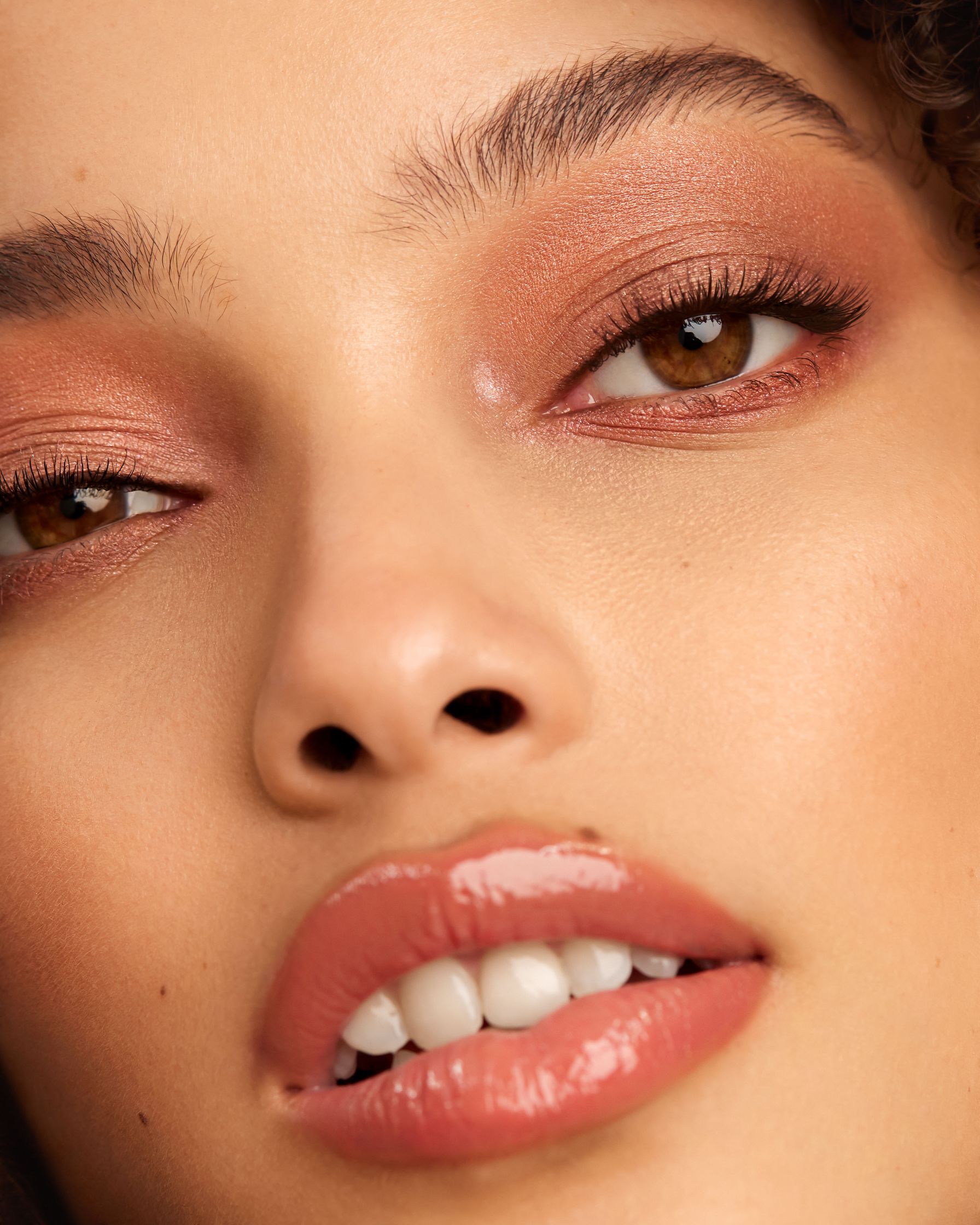 a close up of a woman with curly hair