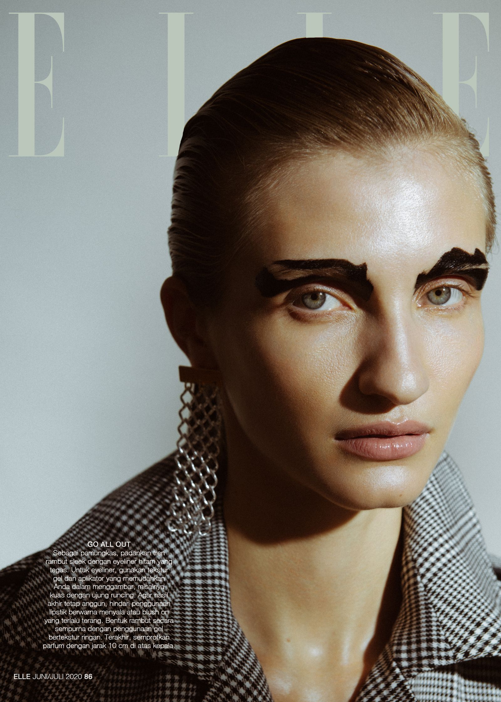 the cover of elle magazine features a woman with black eyeliner