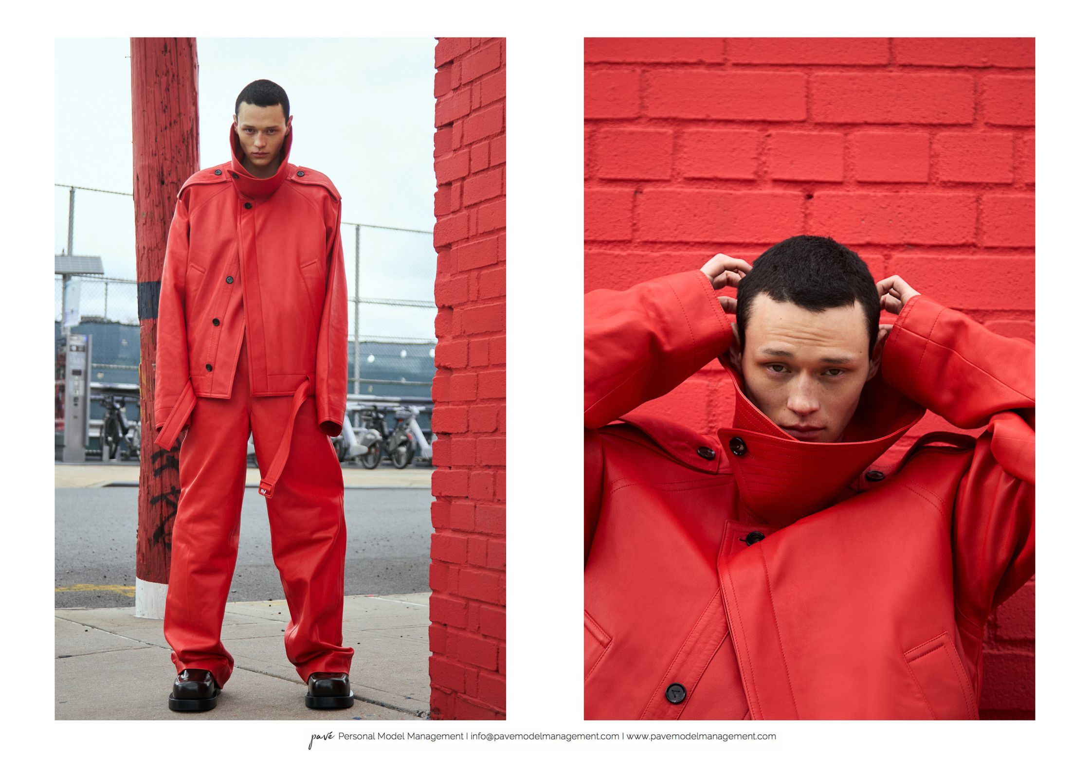 A modeling shot showing a man in a red leather outfit standing next to a red brick wall.