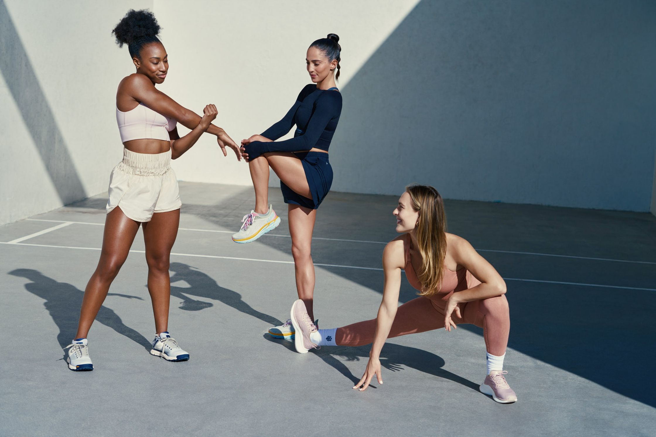 three women are stretching